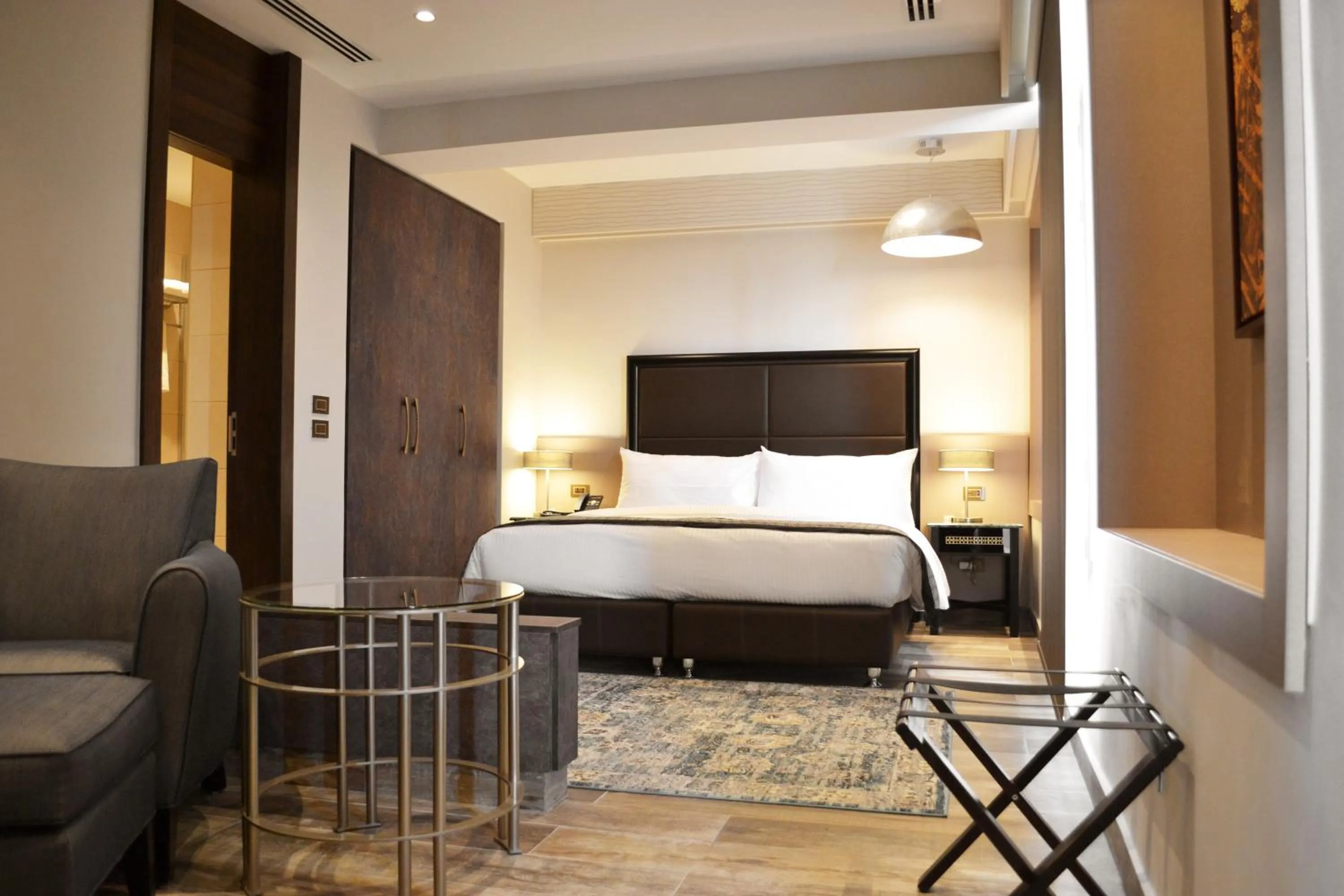 Bed in Ambassador, a Boutique Hotel