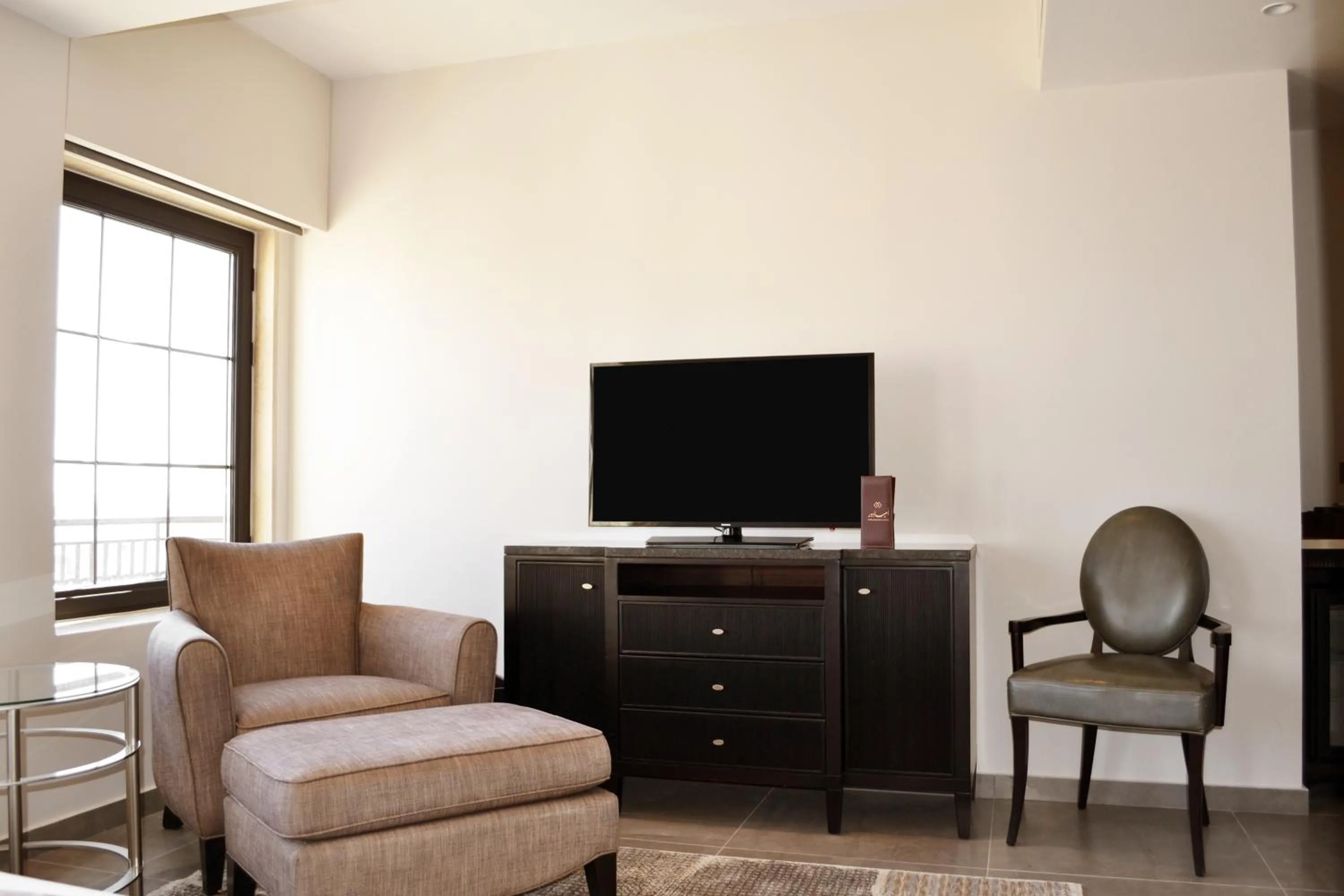 Communal lounge/ TV room in Ambassador, a Boutique Hotel