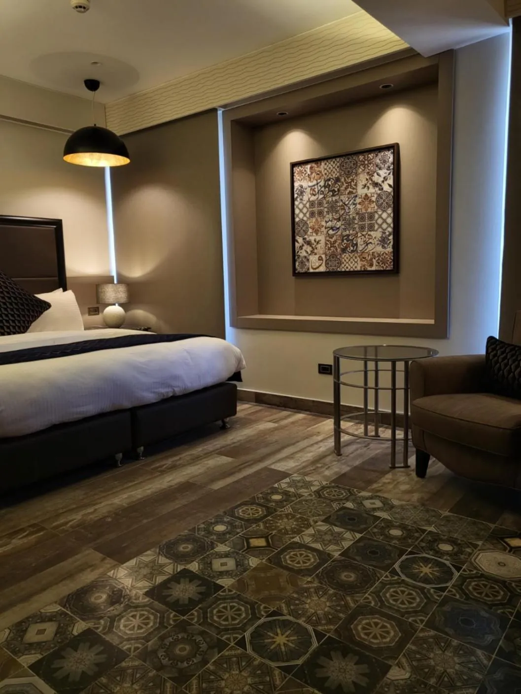 Bed in Ambassador, a Boutique Hotel