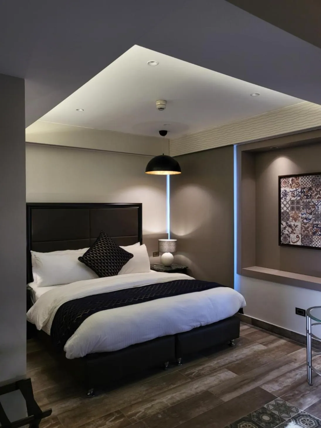 Bed in Ambassador, a Boutique Hotel