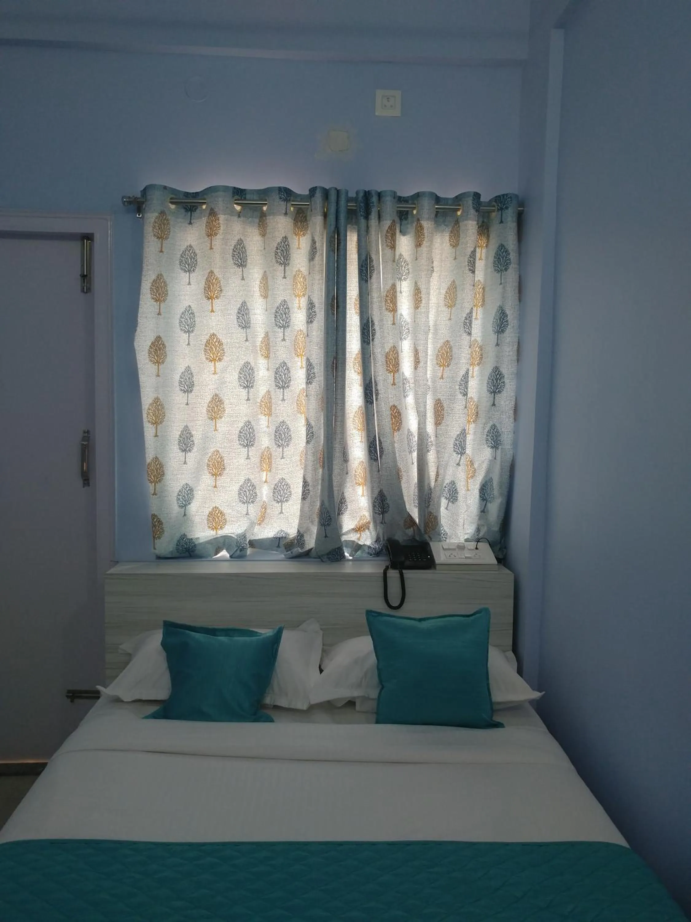 Bedroom, Bed in Sai Inn Mysore