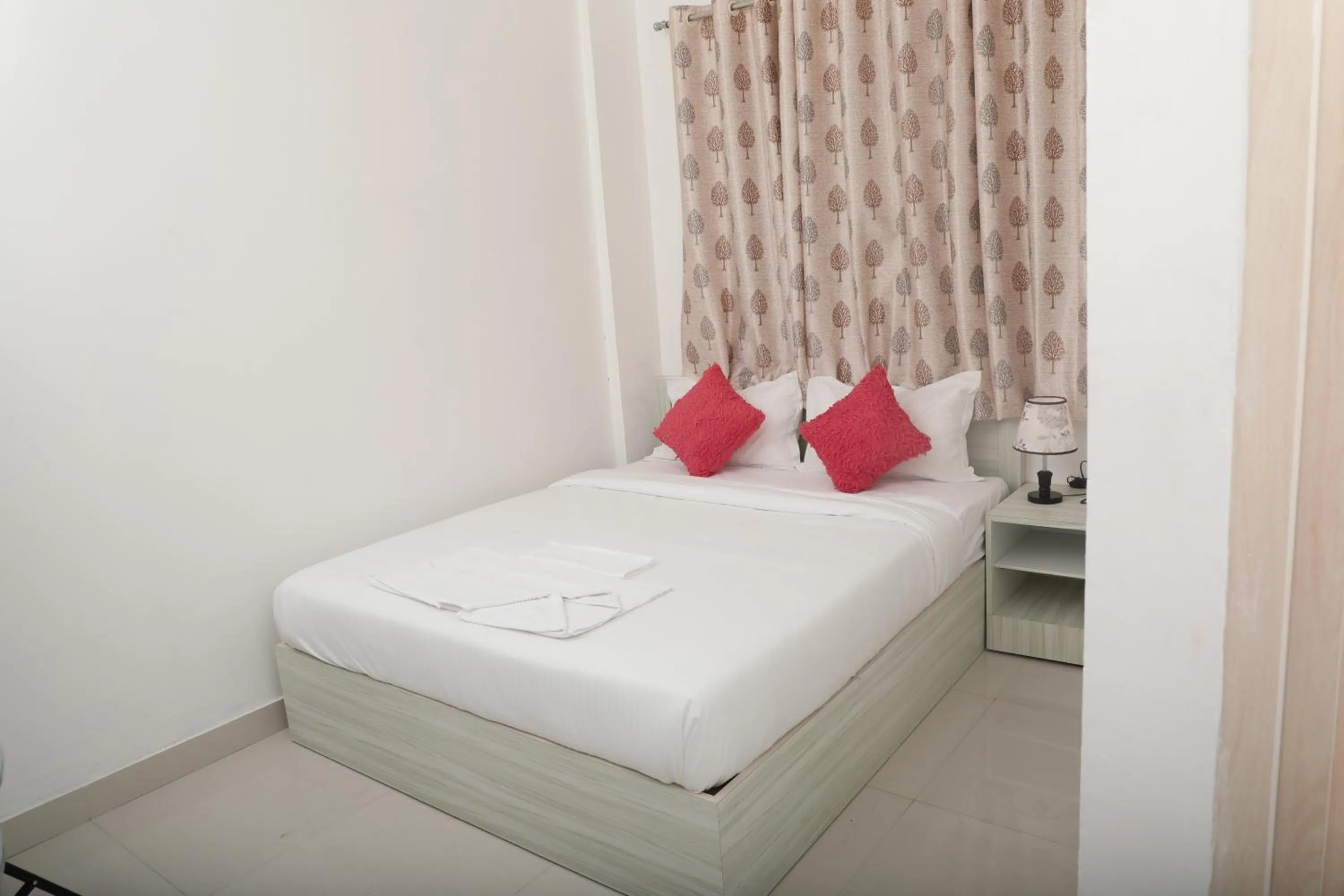 Bed in Sai Inn Mysore