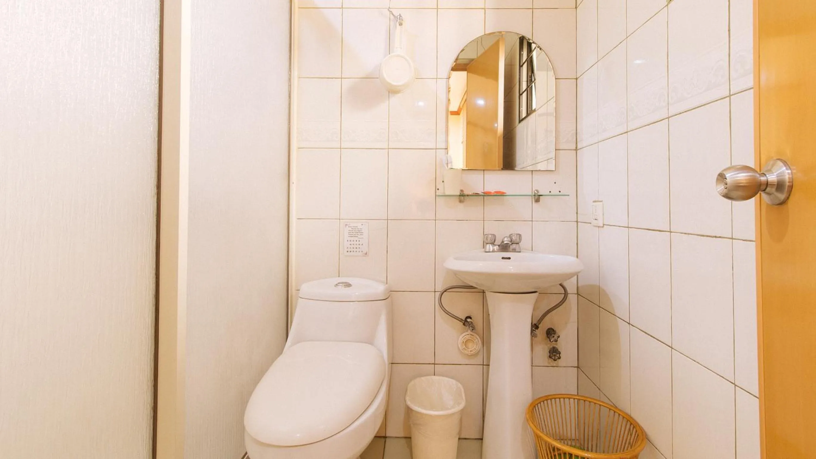 Shower in Peace Hotel by RedDoorz