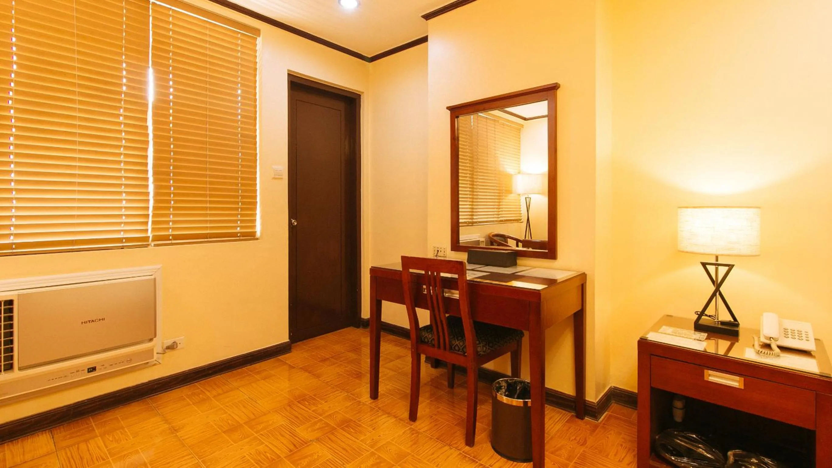 Seating area in Peace Hotel by RedDoorz