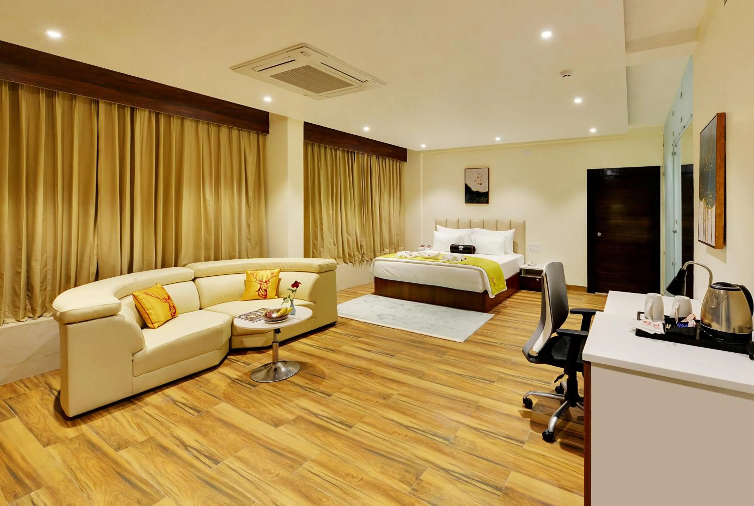 Bed in Mastiff Select Gulbarga Hotel