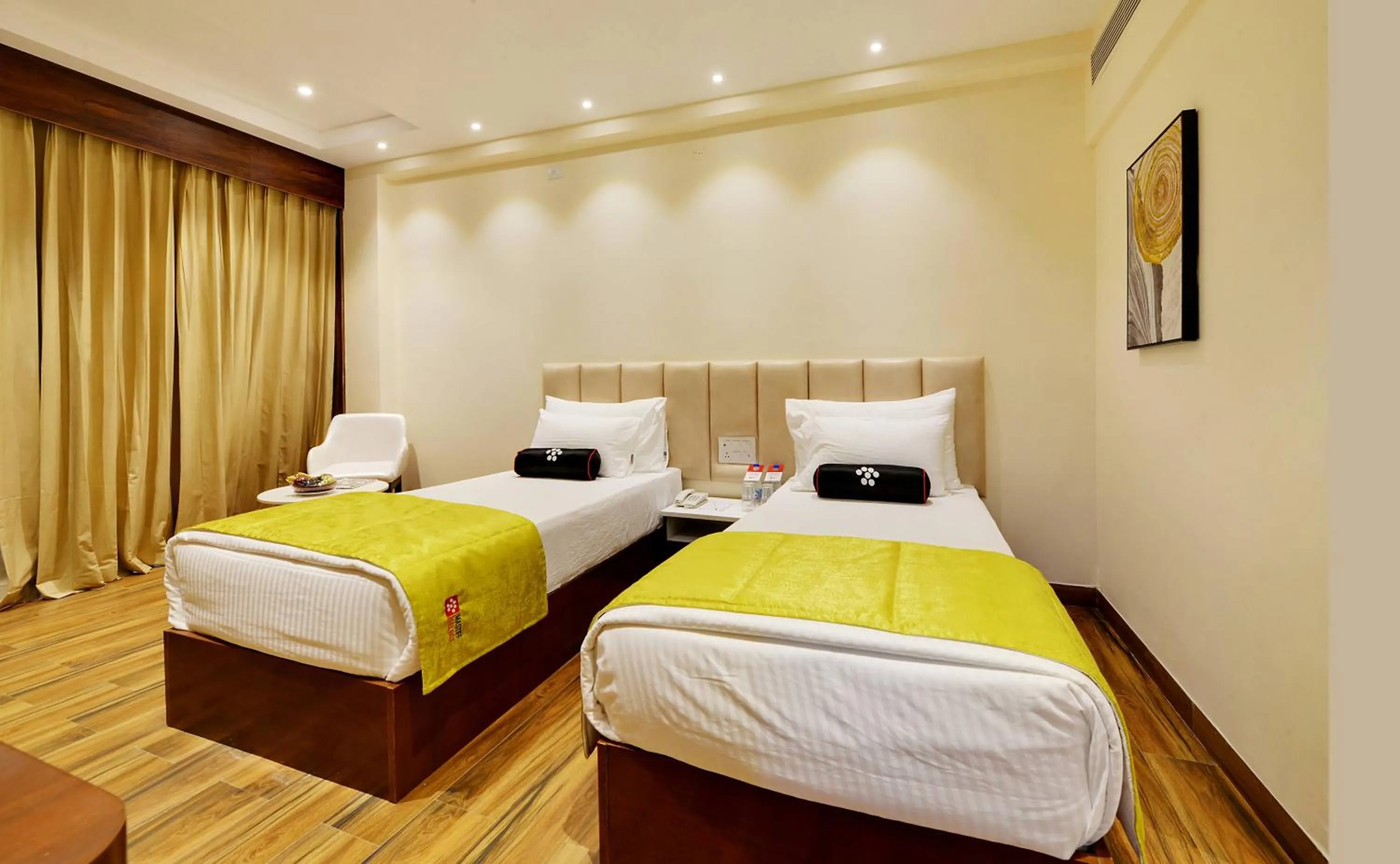 Bed in Mastiff Select Gulbarga Hotel