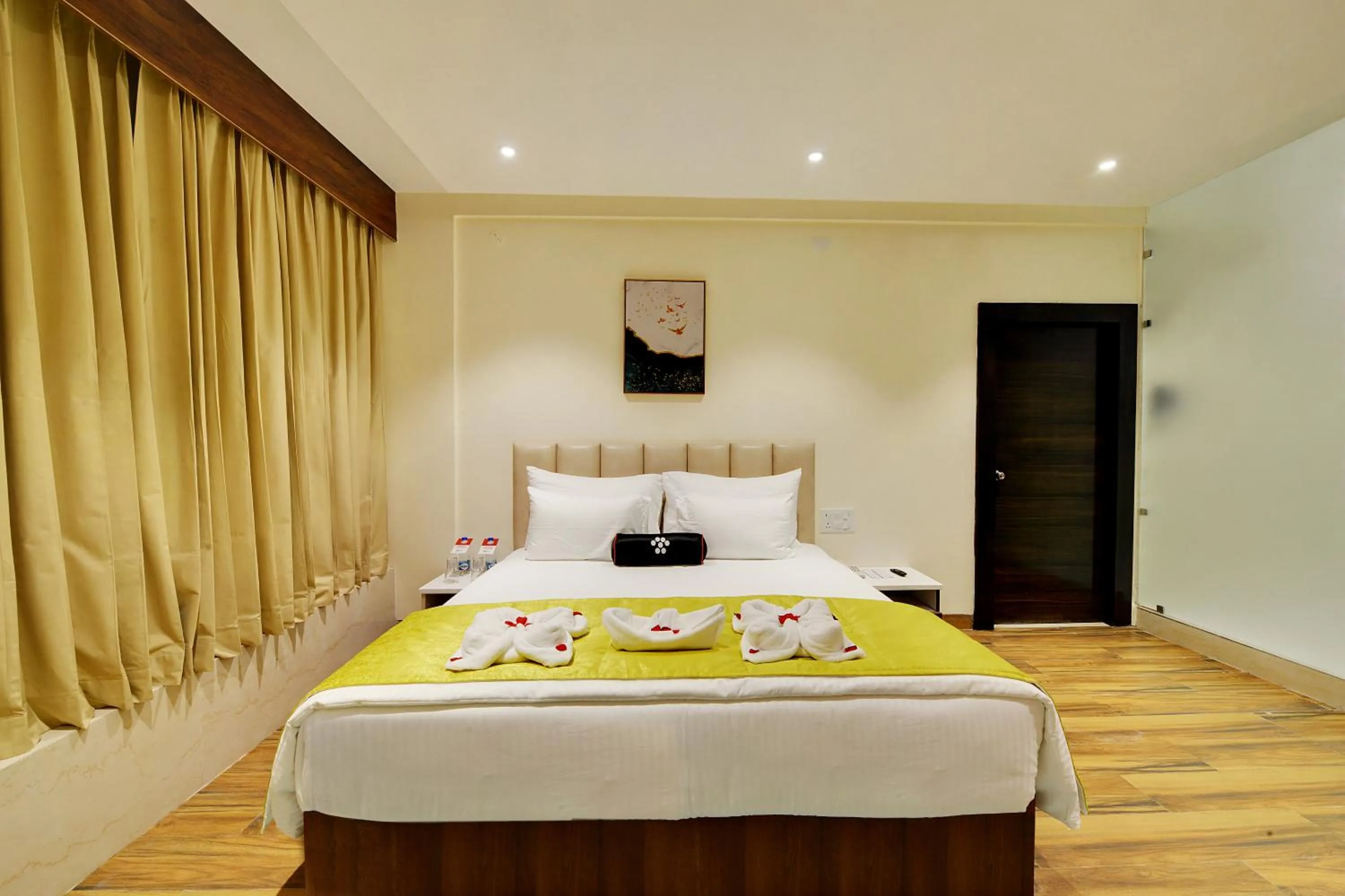 Bed in Mastiff Select Gulbarga Hotel