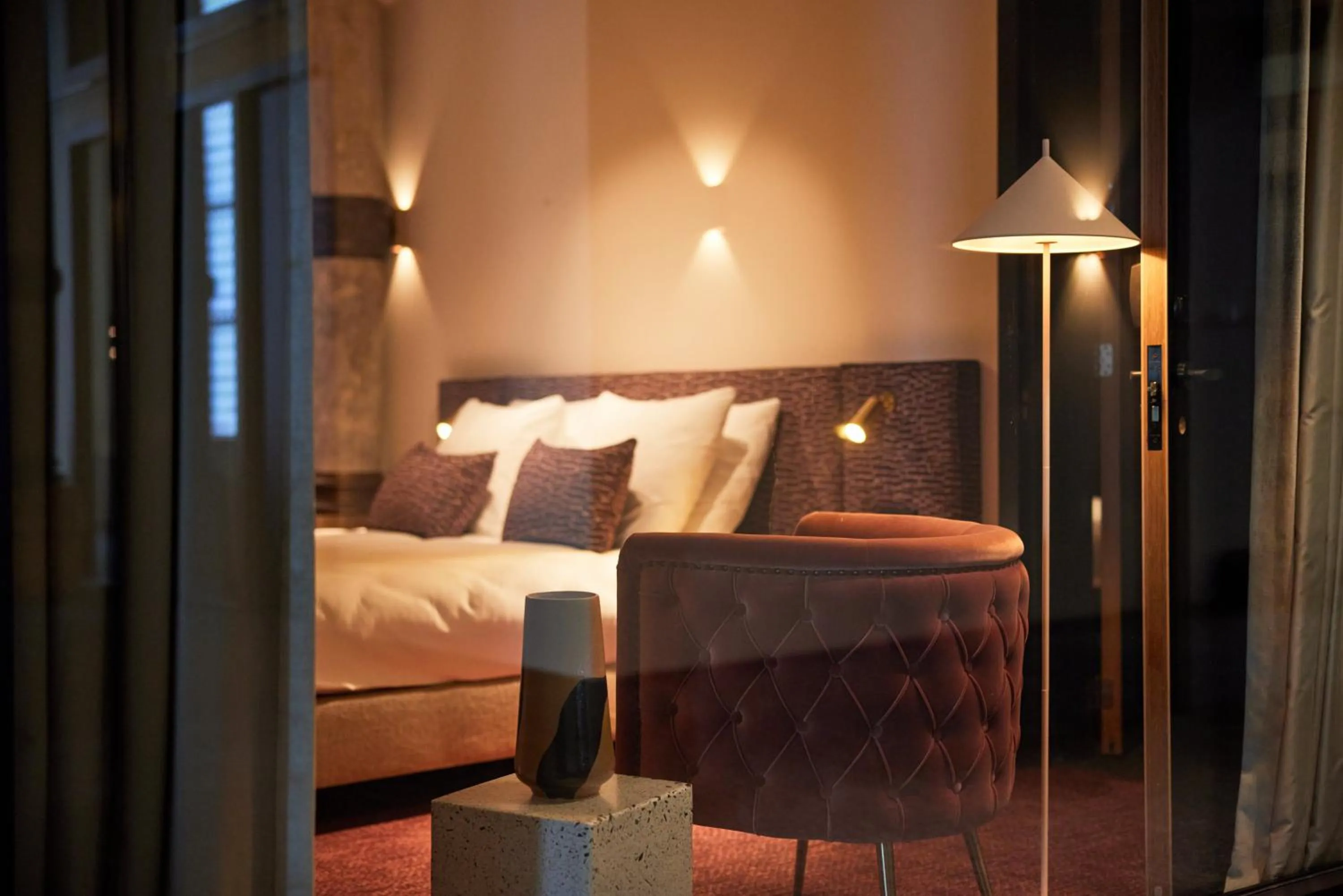 Seating area, Bed in Heavens Hotel