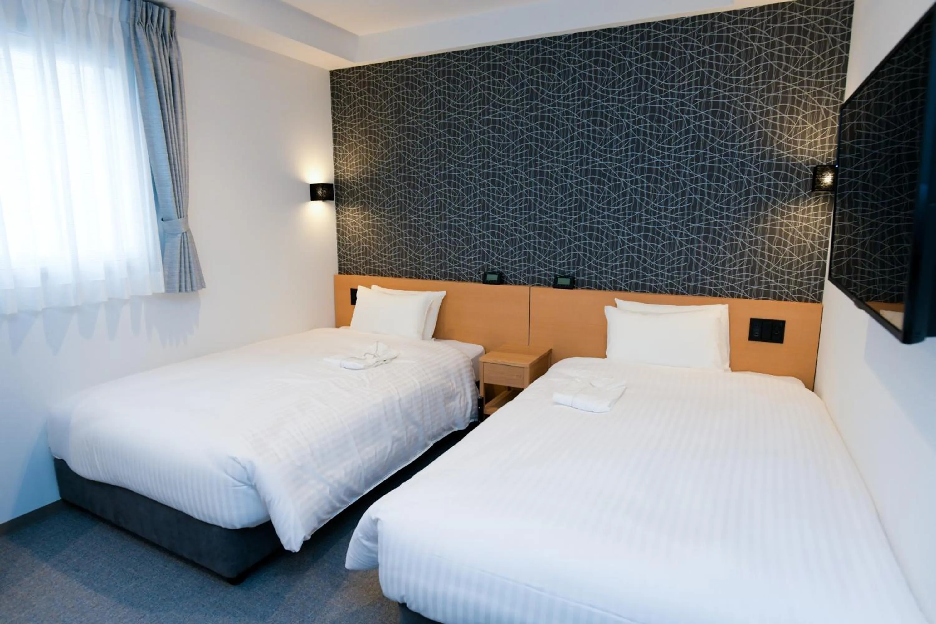 Bed in YOU STYLE HOTEL HAKATA