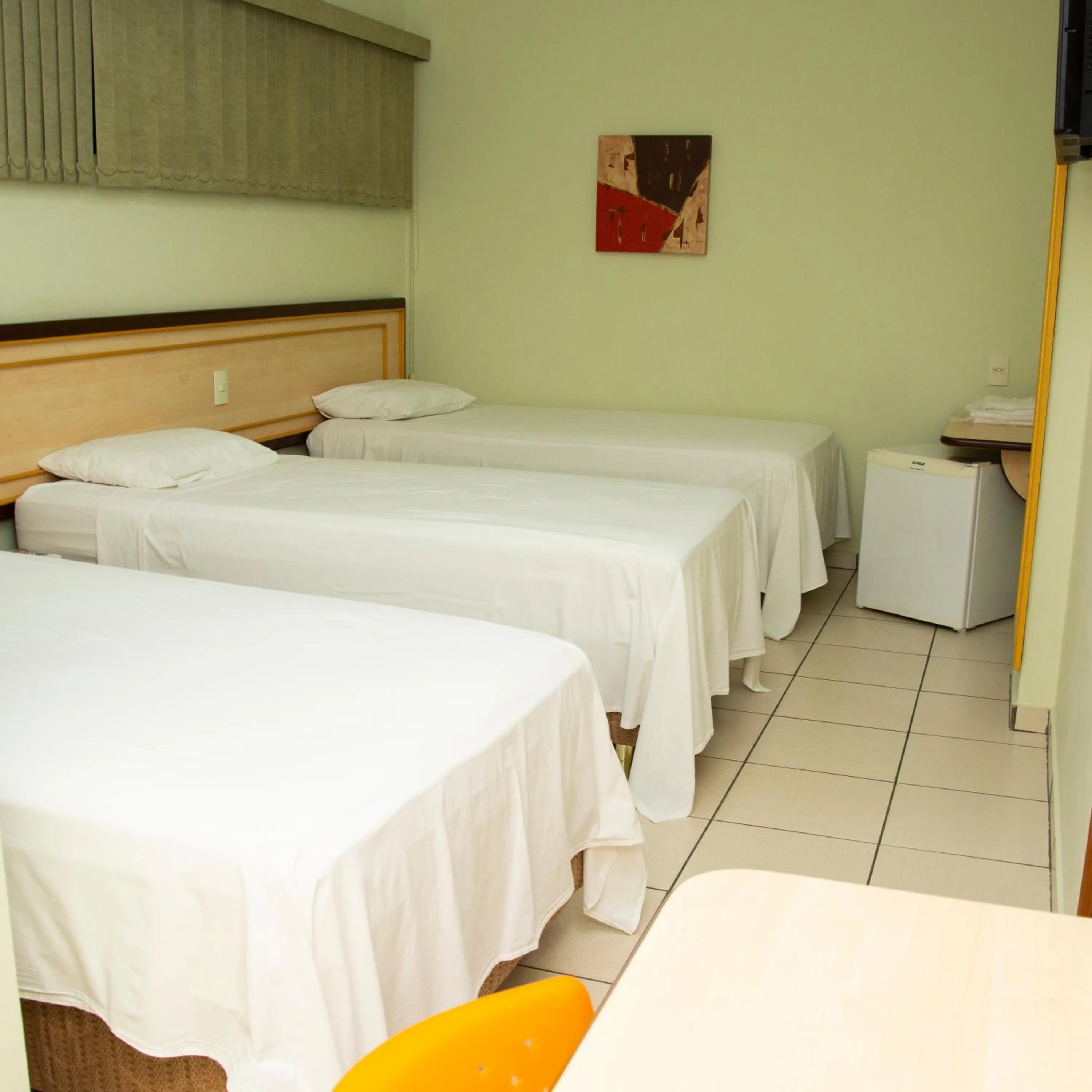 Bed in Larison Ji-Paraná by - Easy Hotéis