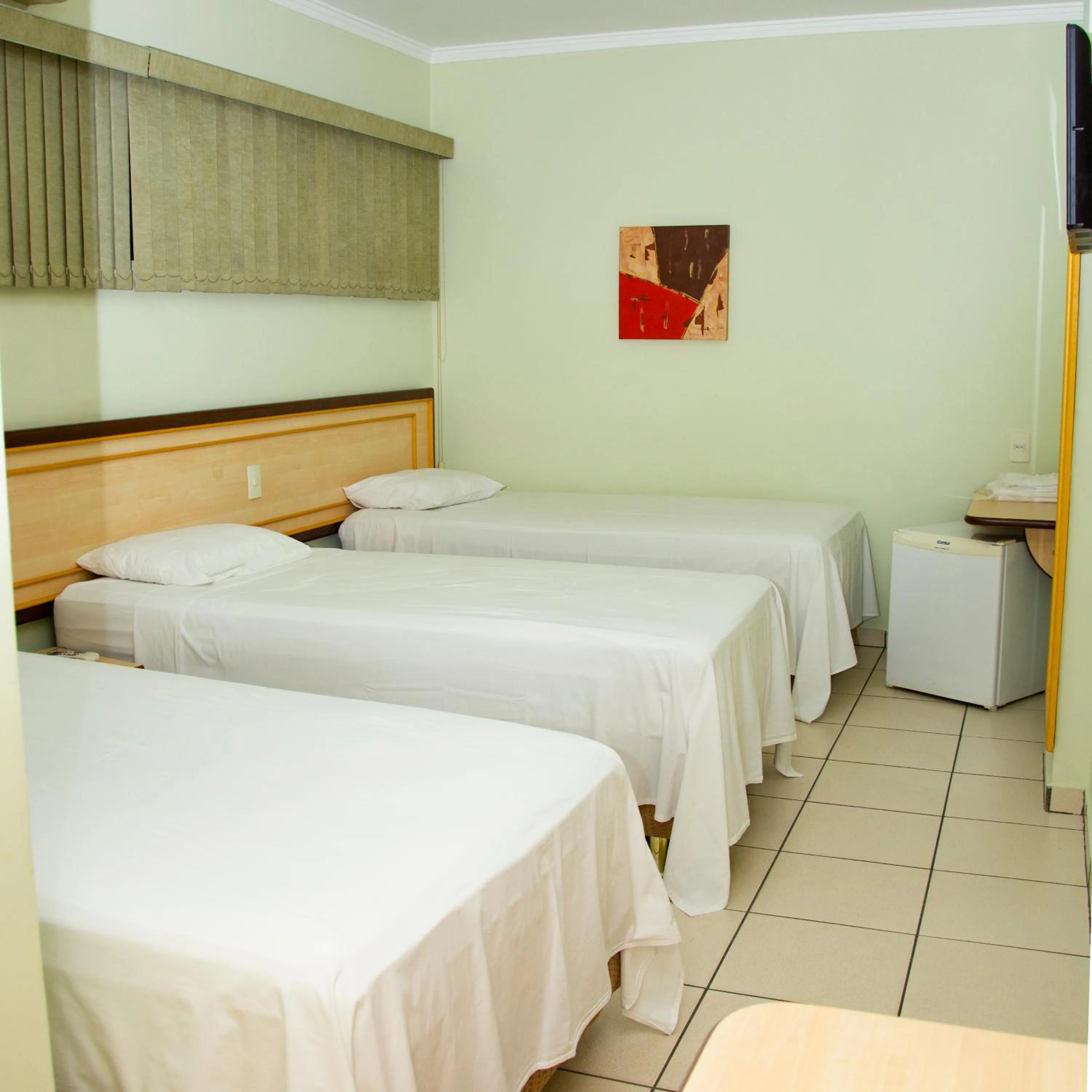 Bed in Larison Ji-Paraná by - Easy Hotéis