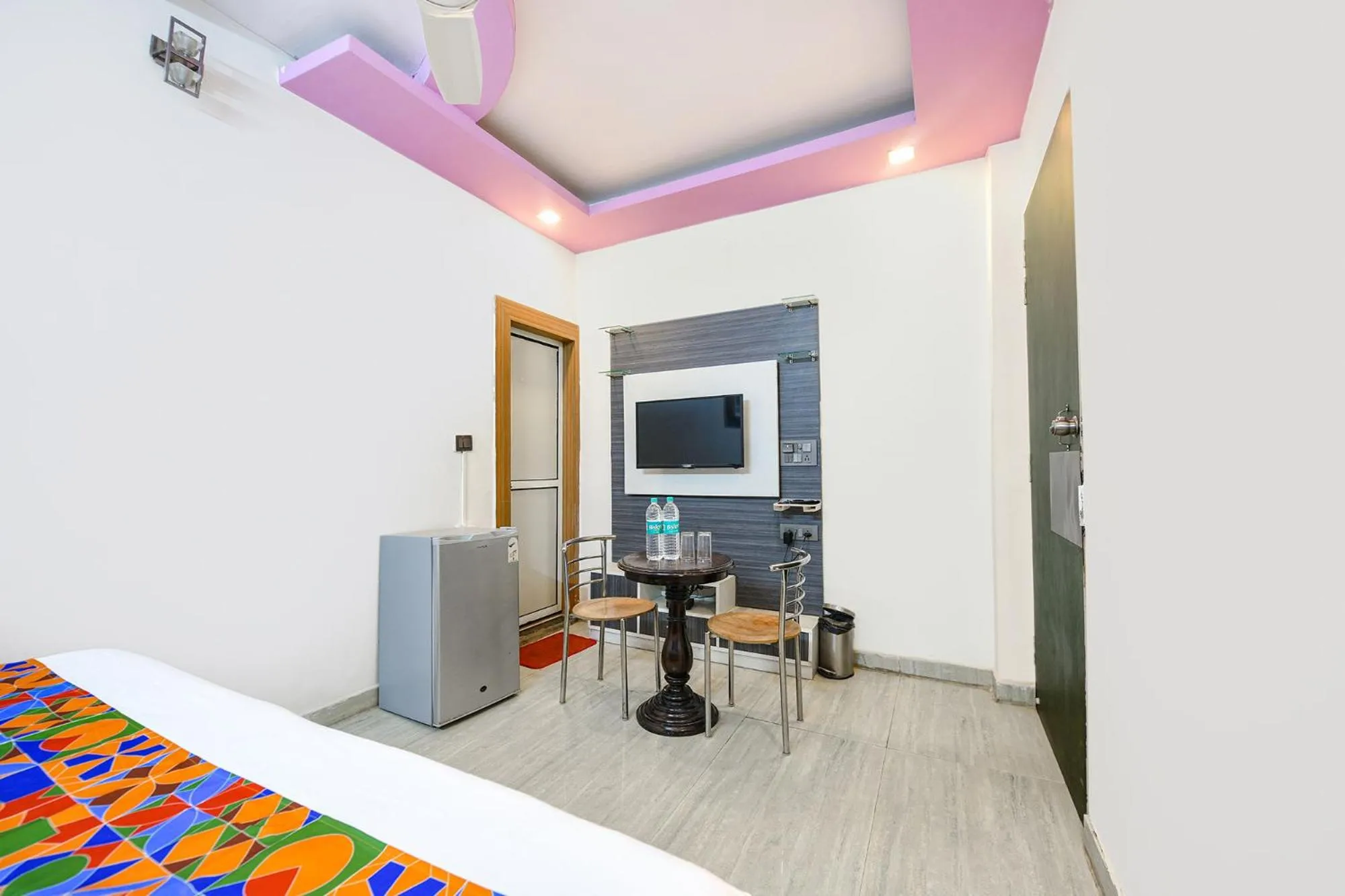 Bed in FabHotel Capital Inn