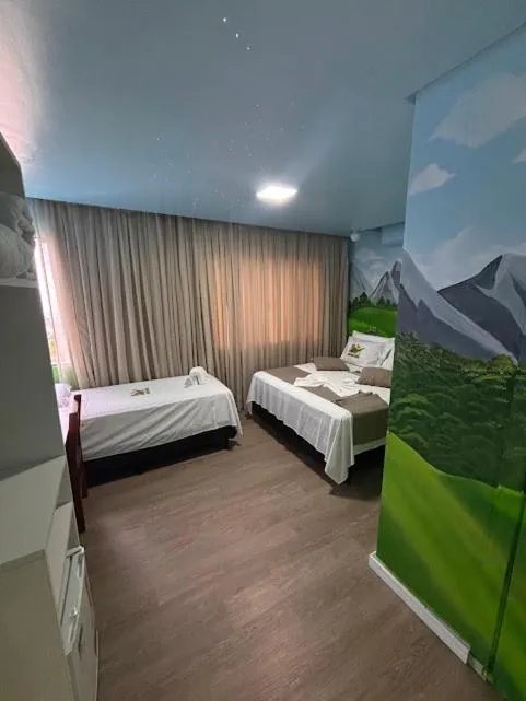 Bed in Hotel Recanto dos Dinossauros