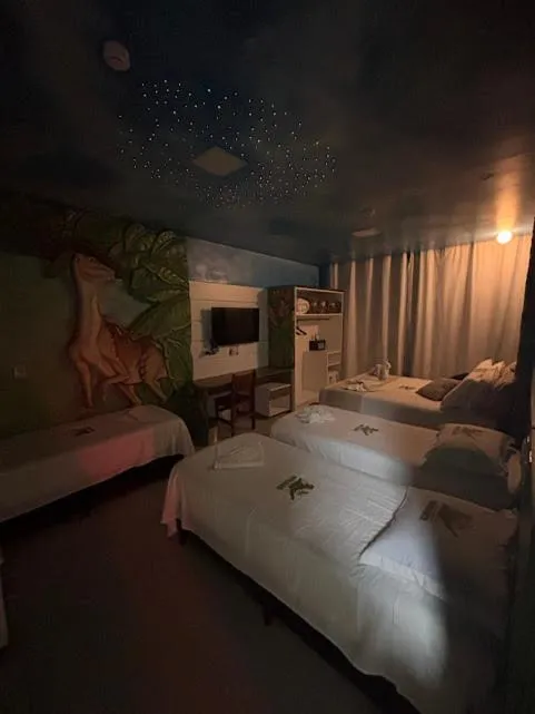 Bed in Hotel Recanto dos Dinossauros
