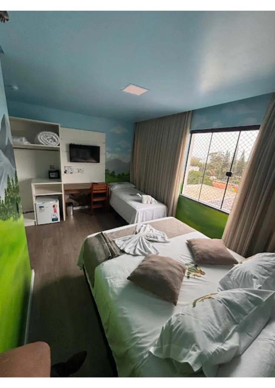 Bed in Hotel Recanto dos Dinossauros