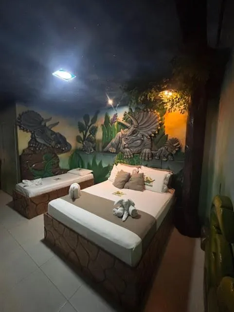 Bed in Hotel Recanto dos Dinossauros