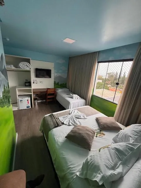 Bed in Hotel Recanto dos Dinossauros
