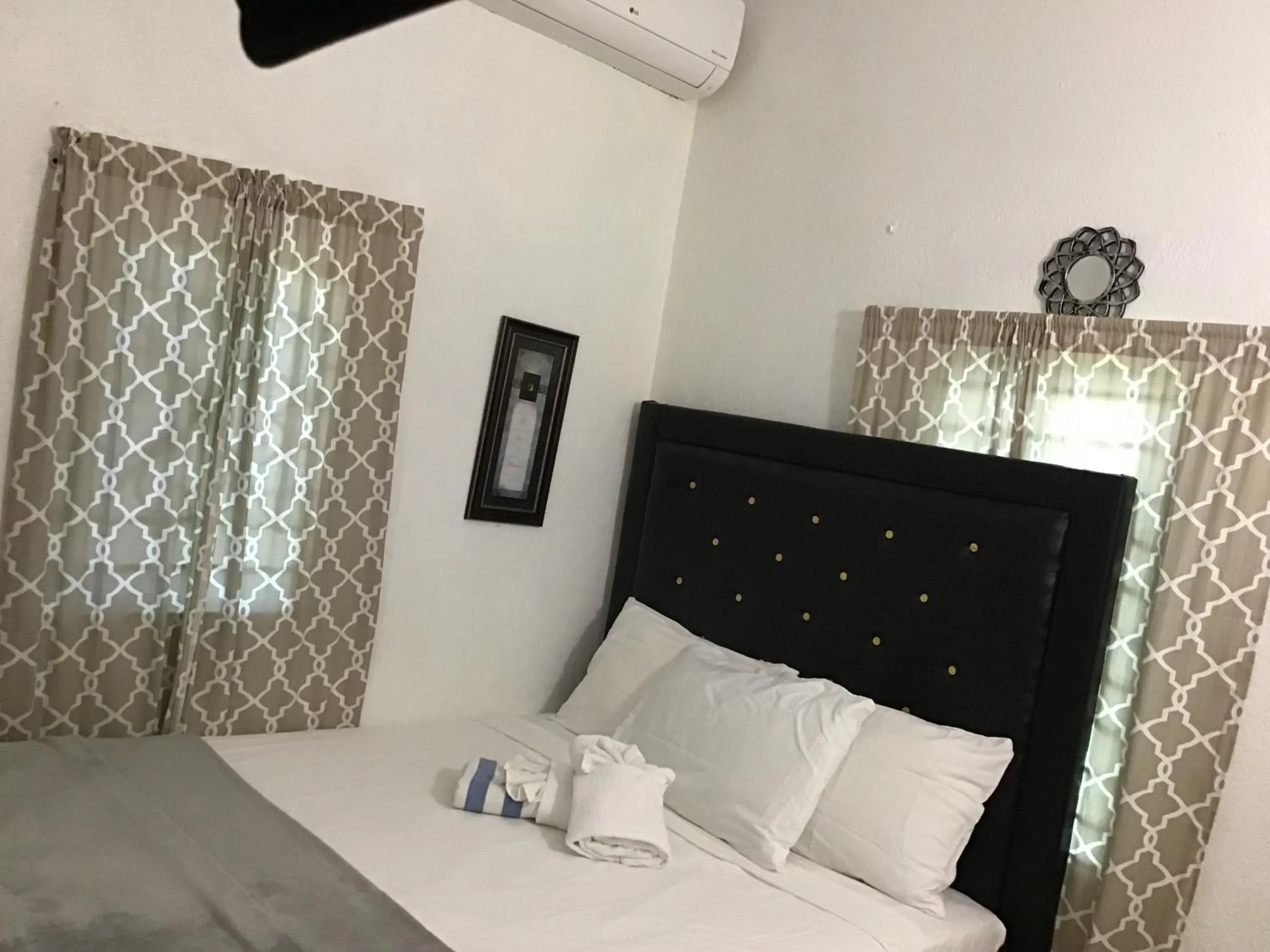 Bed in A taste of Jamaica Lavern’s Place