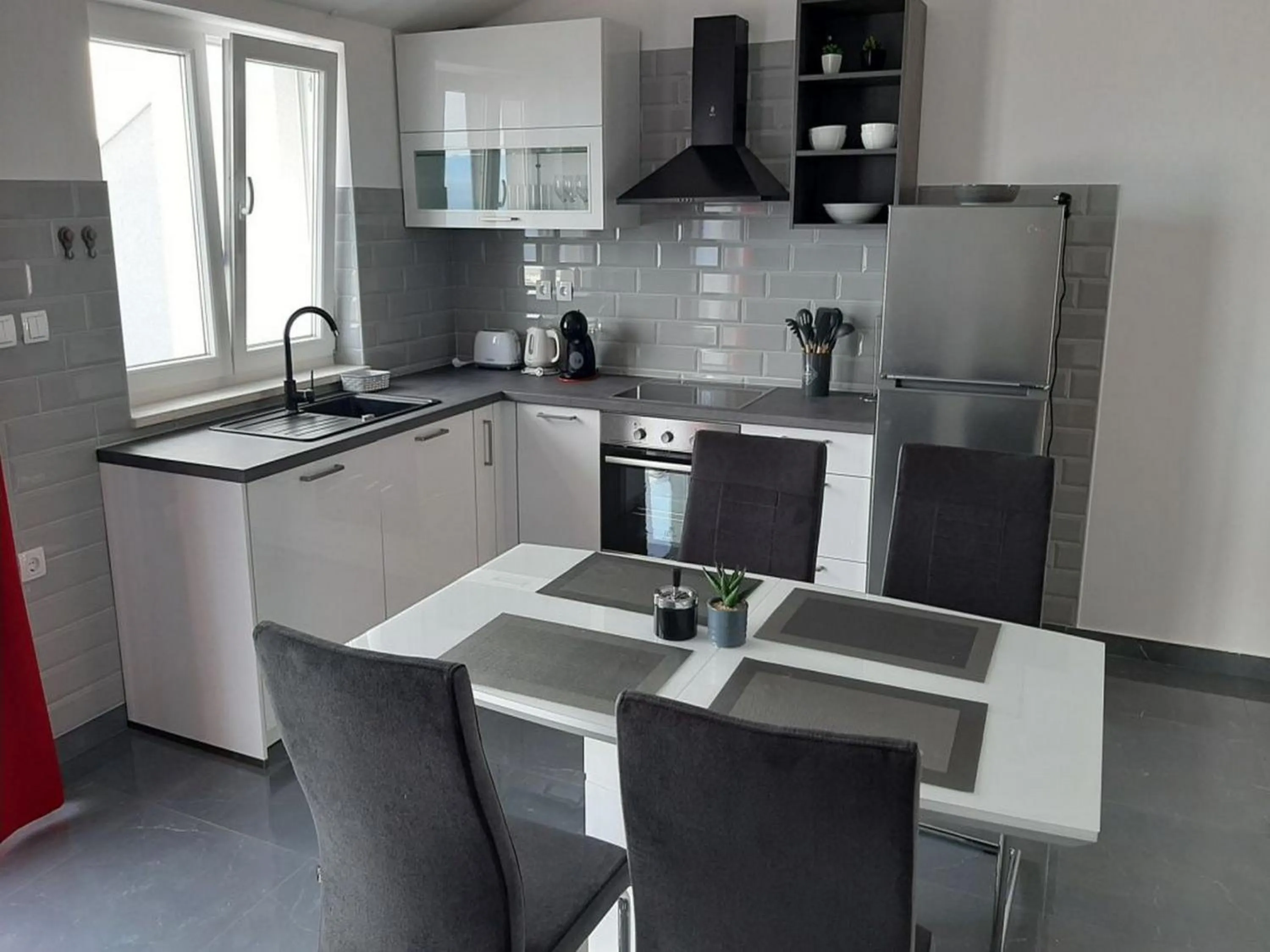 Kitchen or kitchenette in Apartments Dobrila