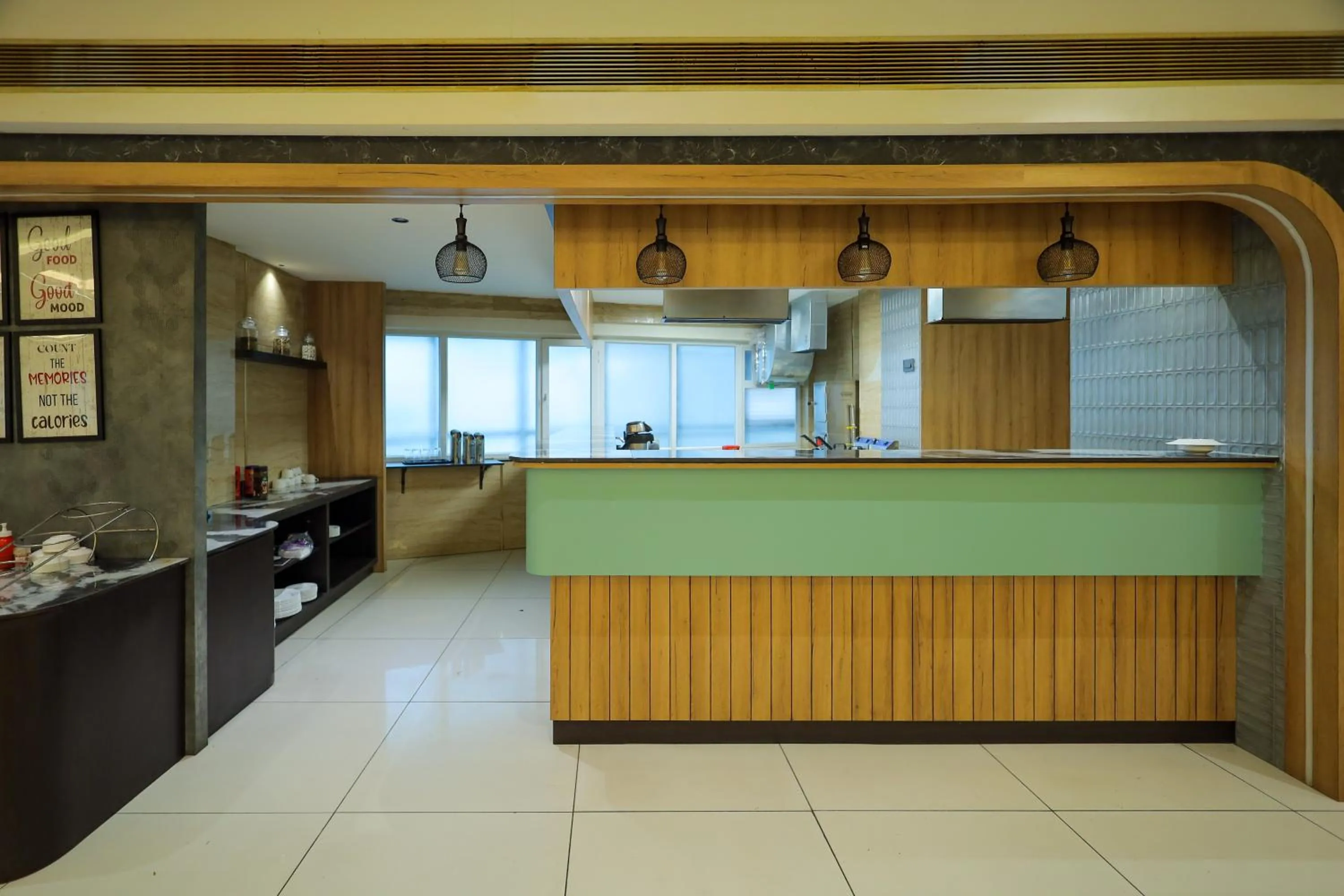 kitchen in Royal Plaza Suites by RAK Rooms, Mangaluru