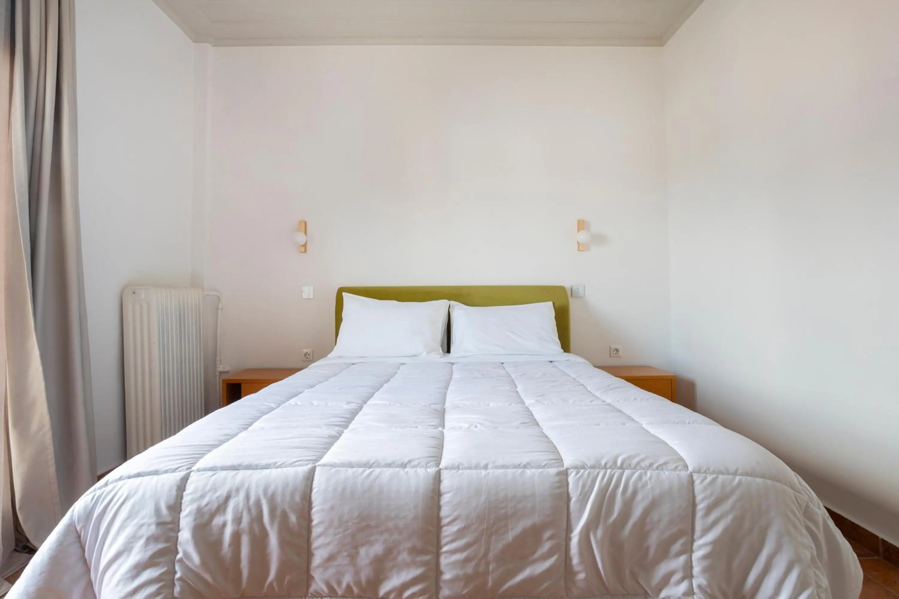 Bed in Hotel Roumani