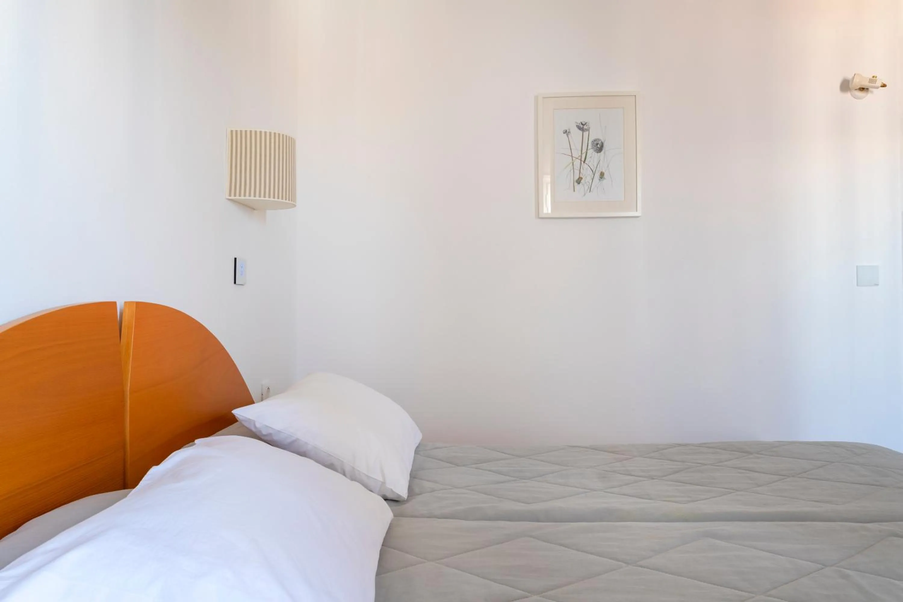 Bed in Hotel Roumani