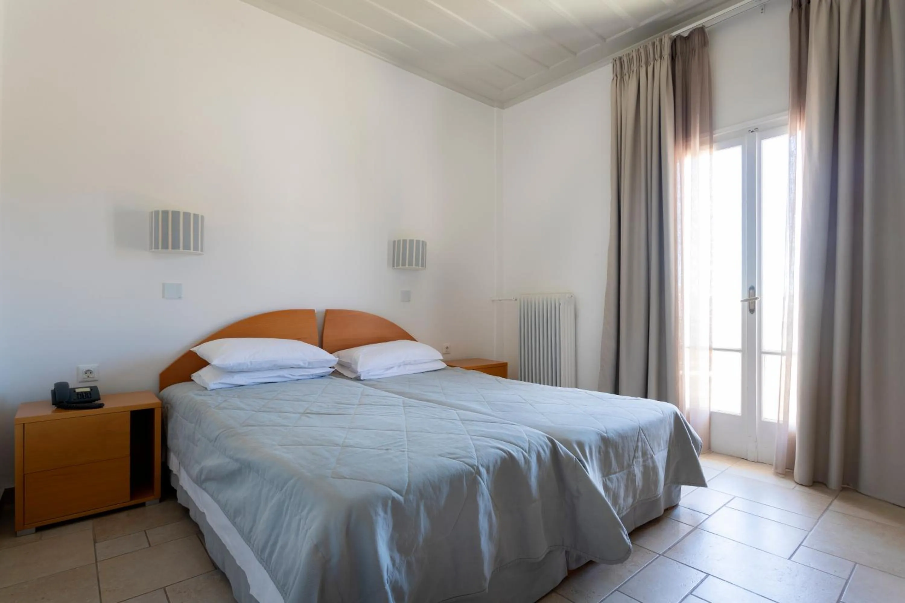 Bed in Hotel Roumani