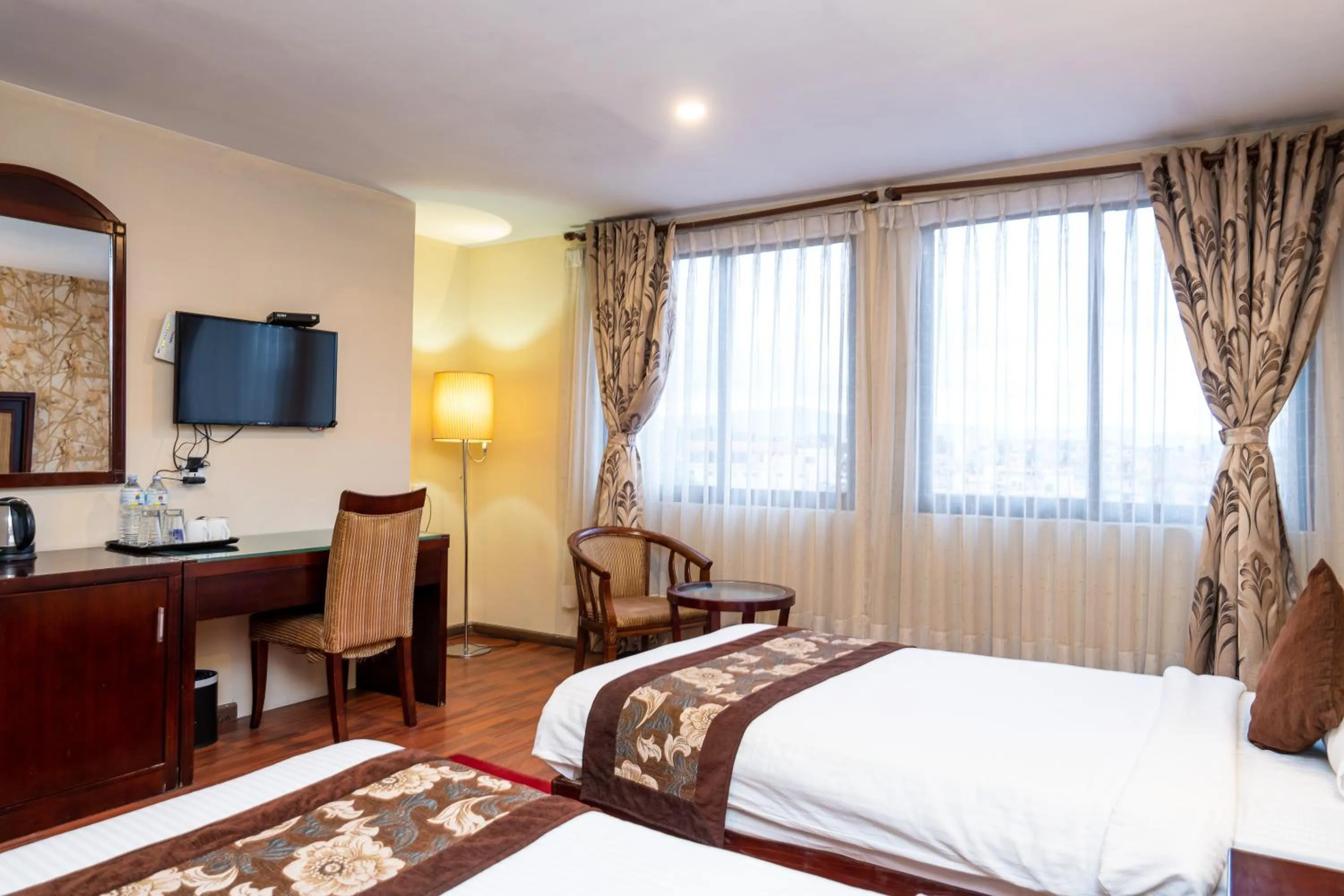 Bed in Hotel Mirage Regency