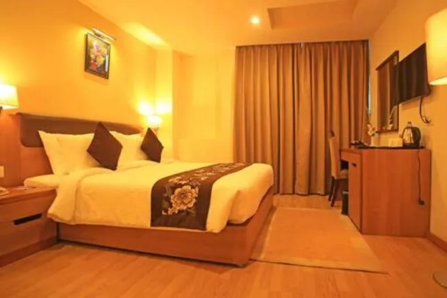 Bed in Hotel Mirage Regency