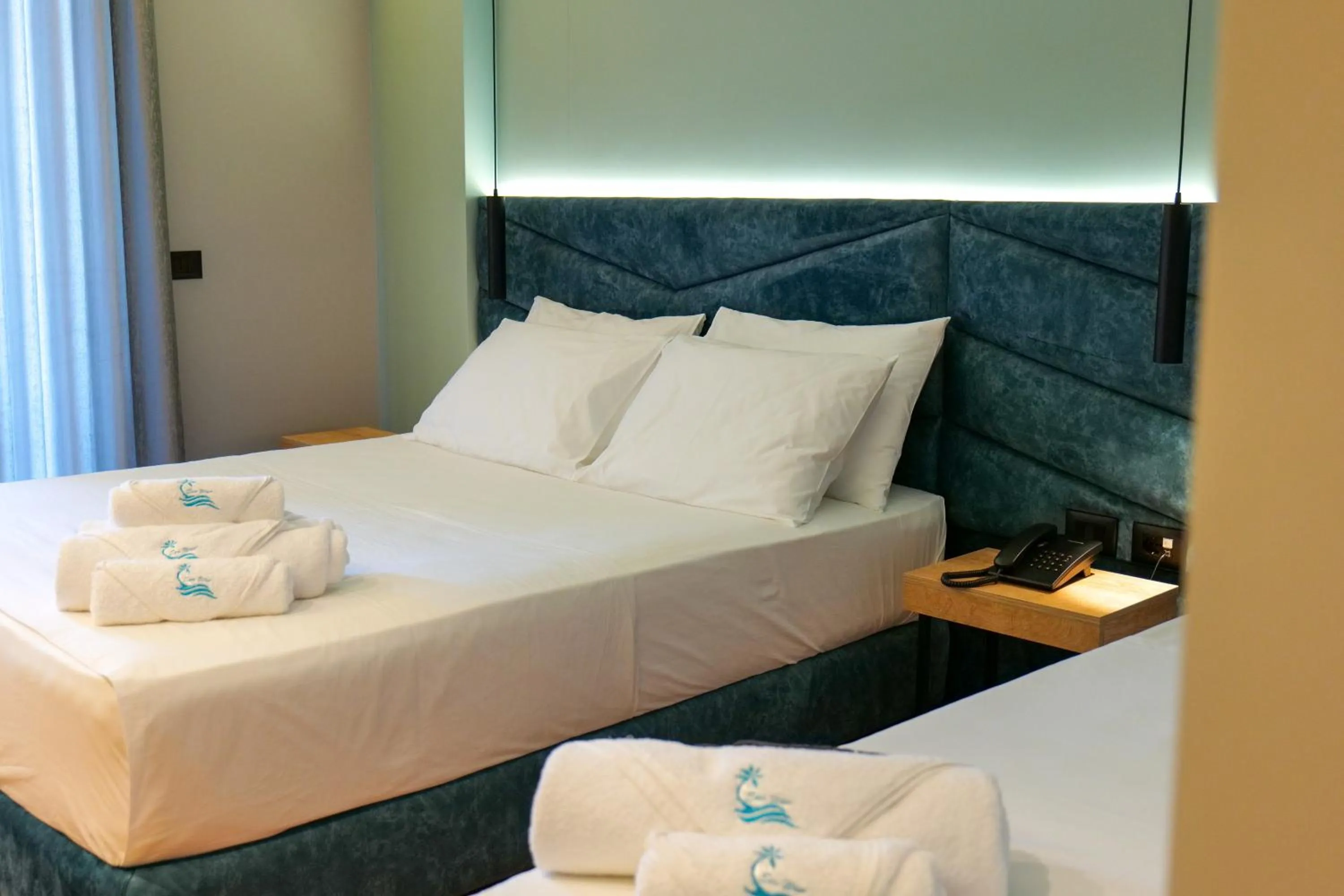 Bed in Seawave Hotel