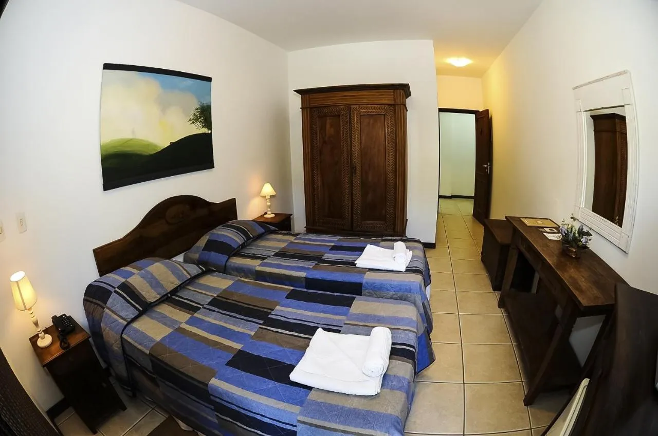 Bed in Pousada Arraial do Ouro