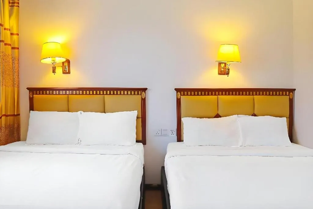 Bed in Borneo Suites Hotel