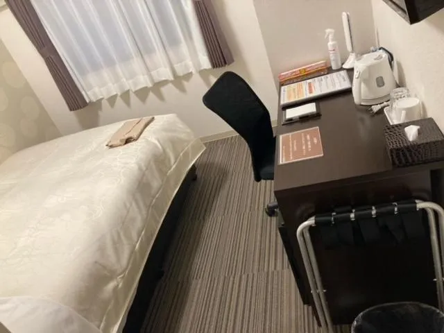 Bed in Station Hotel Nagasaki Suwa