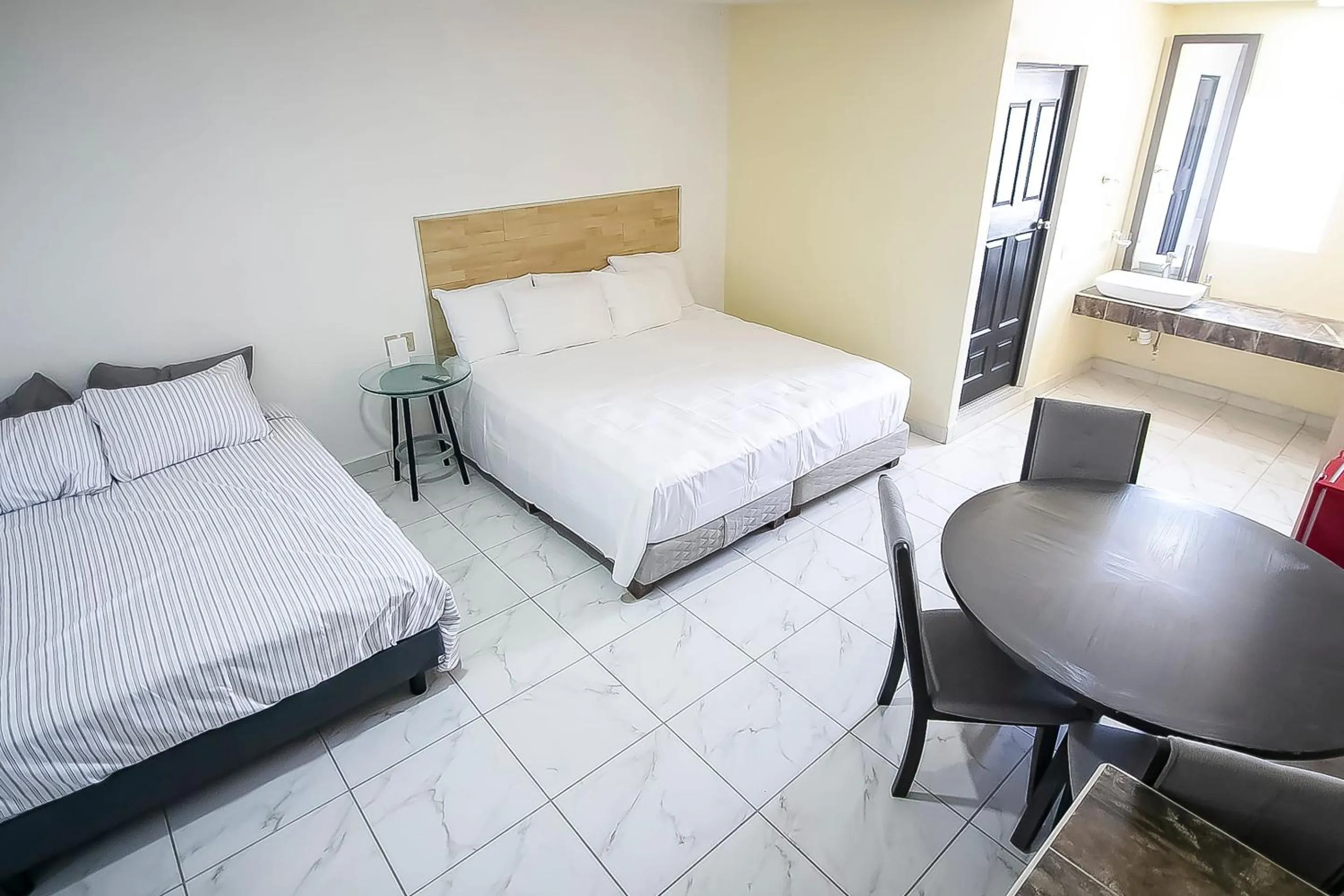 Bedroom, Bed in OYO Hotel Plaza Las Torres, Cabo San Lucas