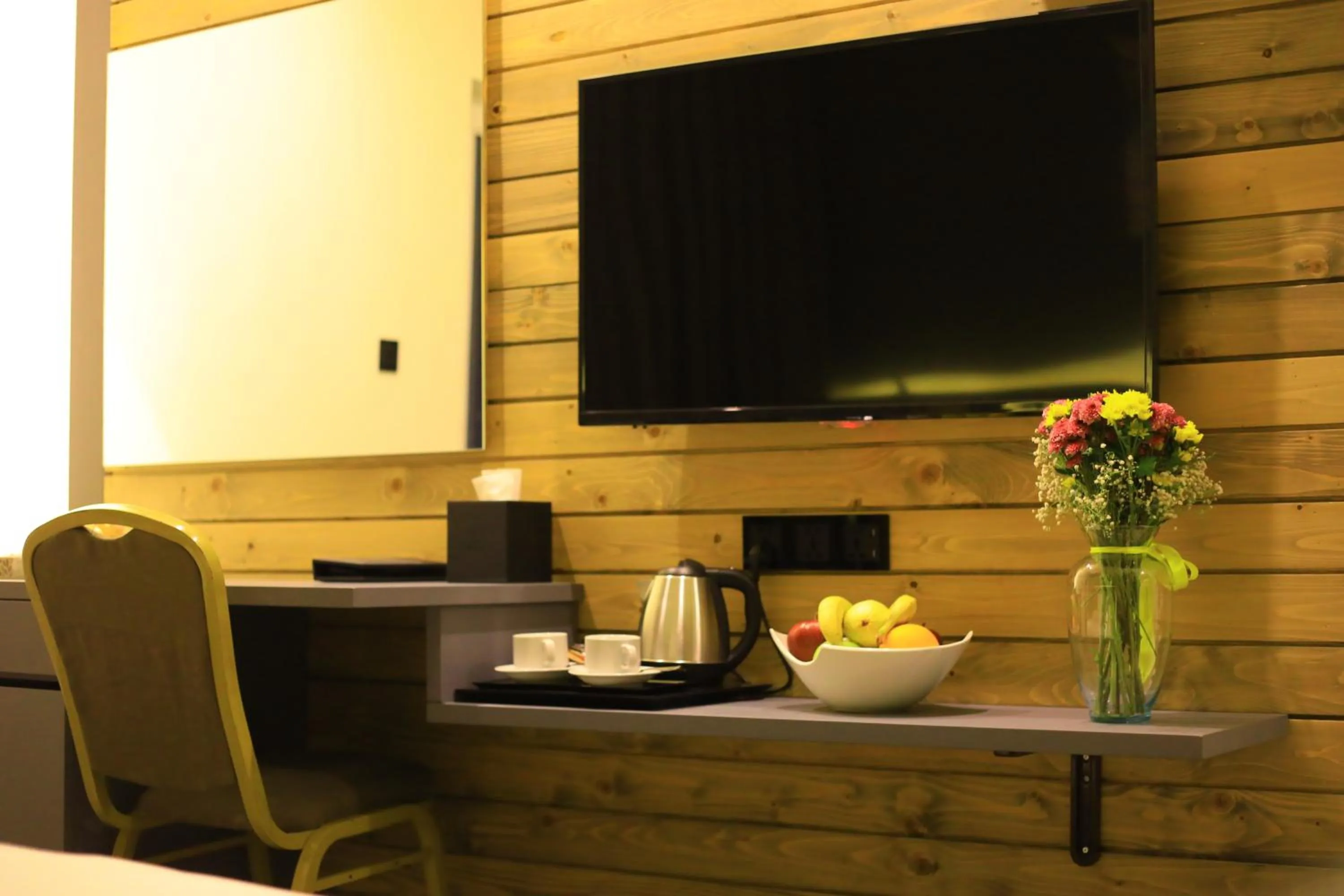 Communal lounge/ TV room in Aitch Boutique Hotel - an LIH Hotel