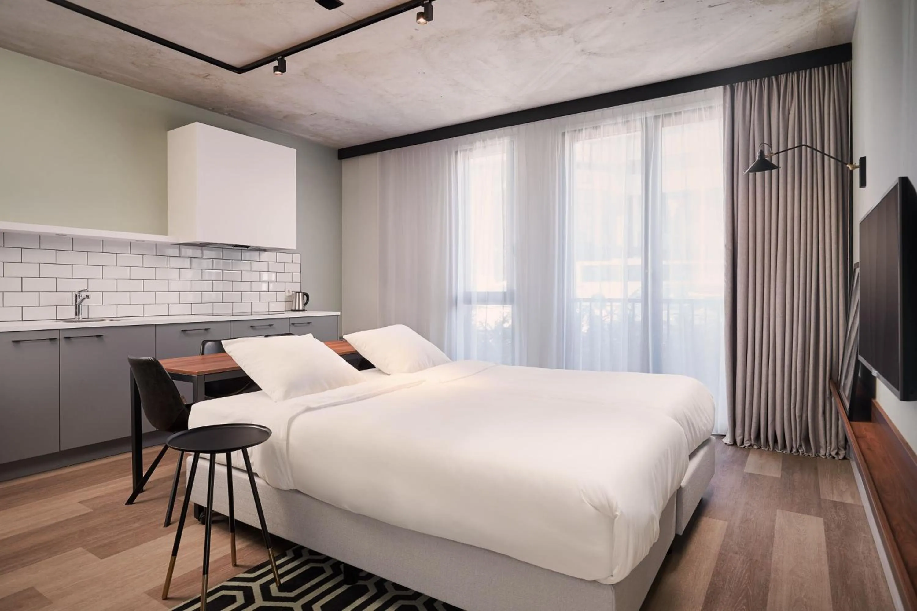 Photo of the whole room, Bed in Corendon Apartments Amsterdam Schiphol Airport