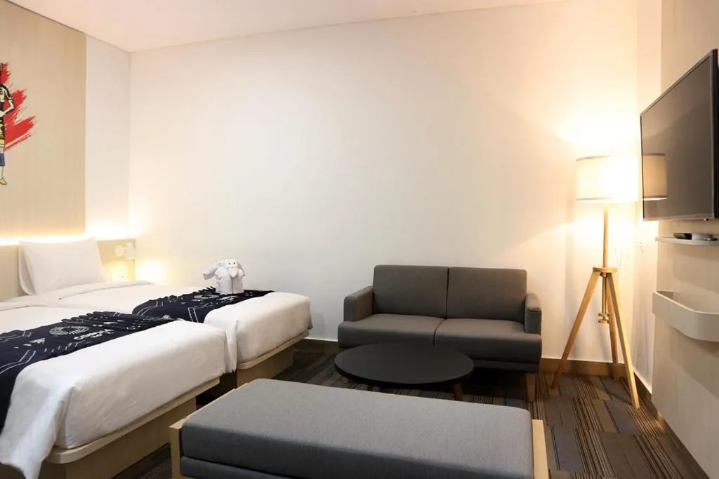 Living room, Bed in Cordia Hotel Banjarmasin - Hotel Dalam Bandara