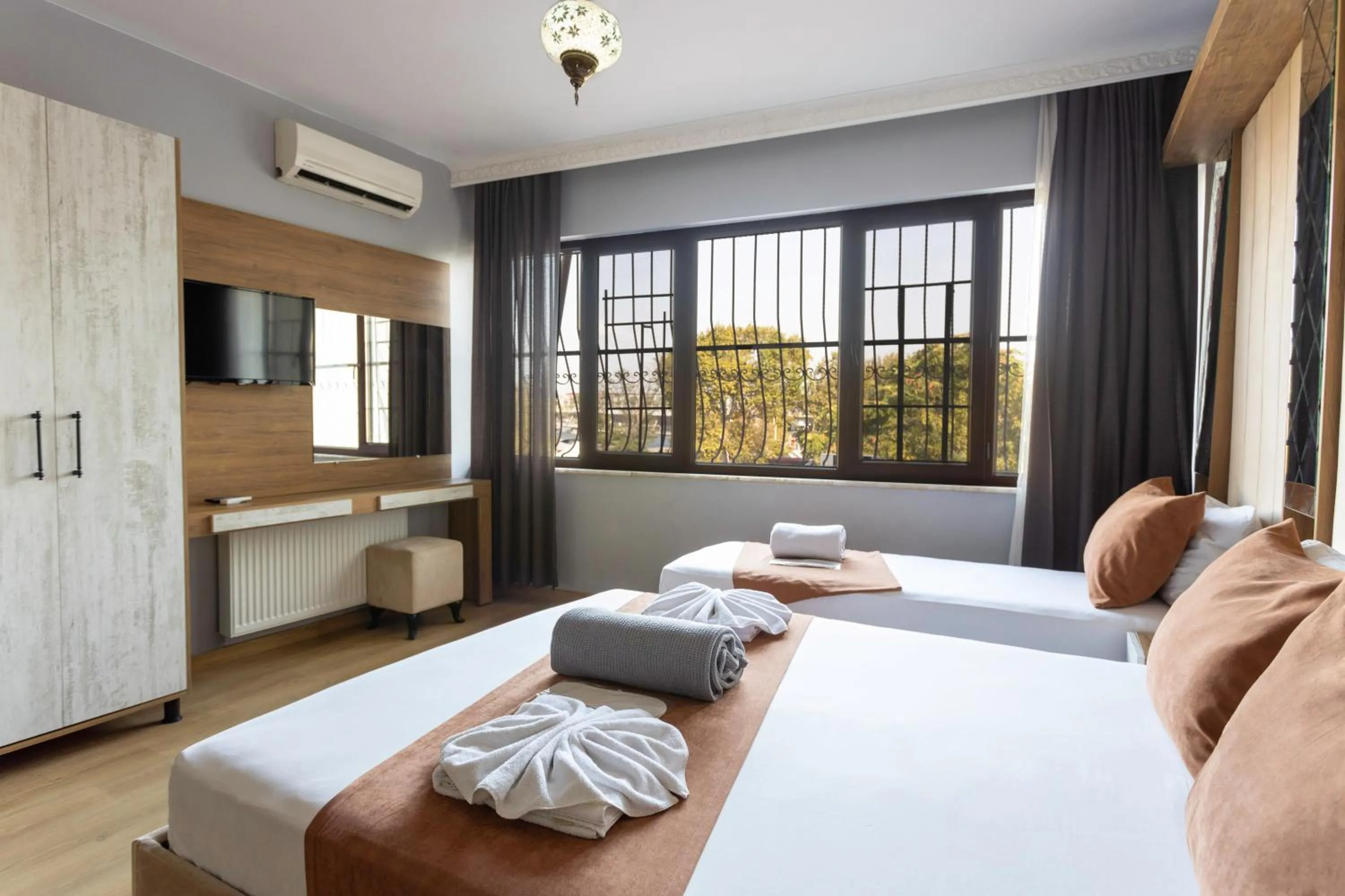 Communal lounge/ TV room in Lumina Boutique Hotel