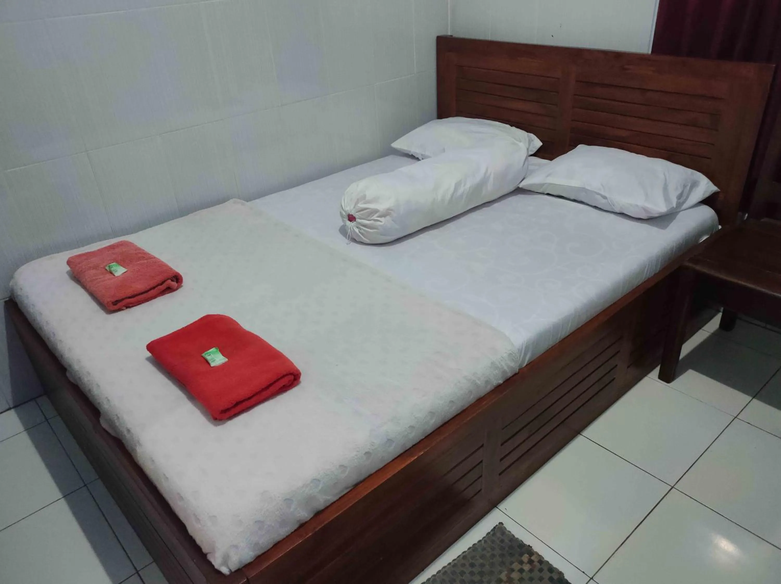 Bed in Penginapan Mentorogo Kaliurang Mitra RedDoorz