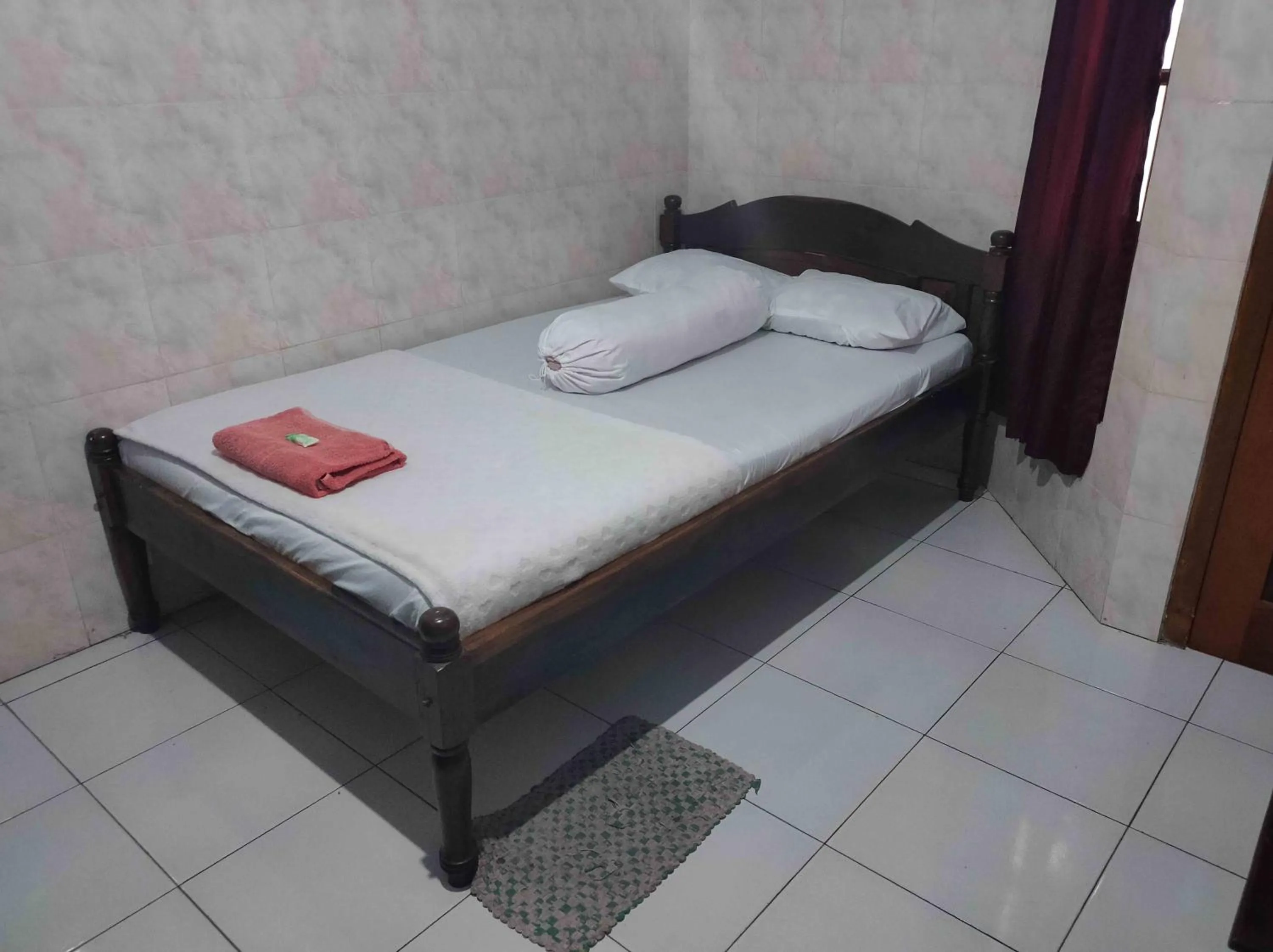 Bed in Penginapan Mentorogo Kaliurang Mitra RedDoorz
