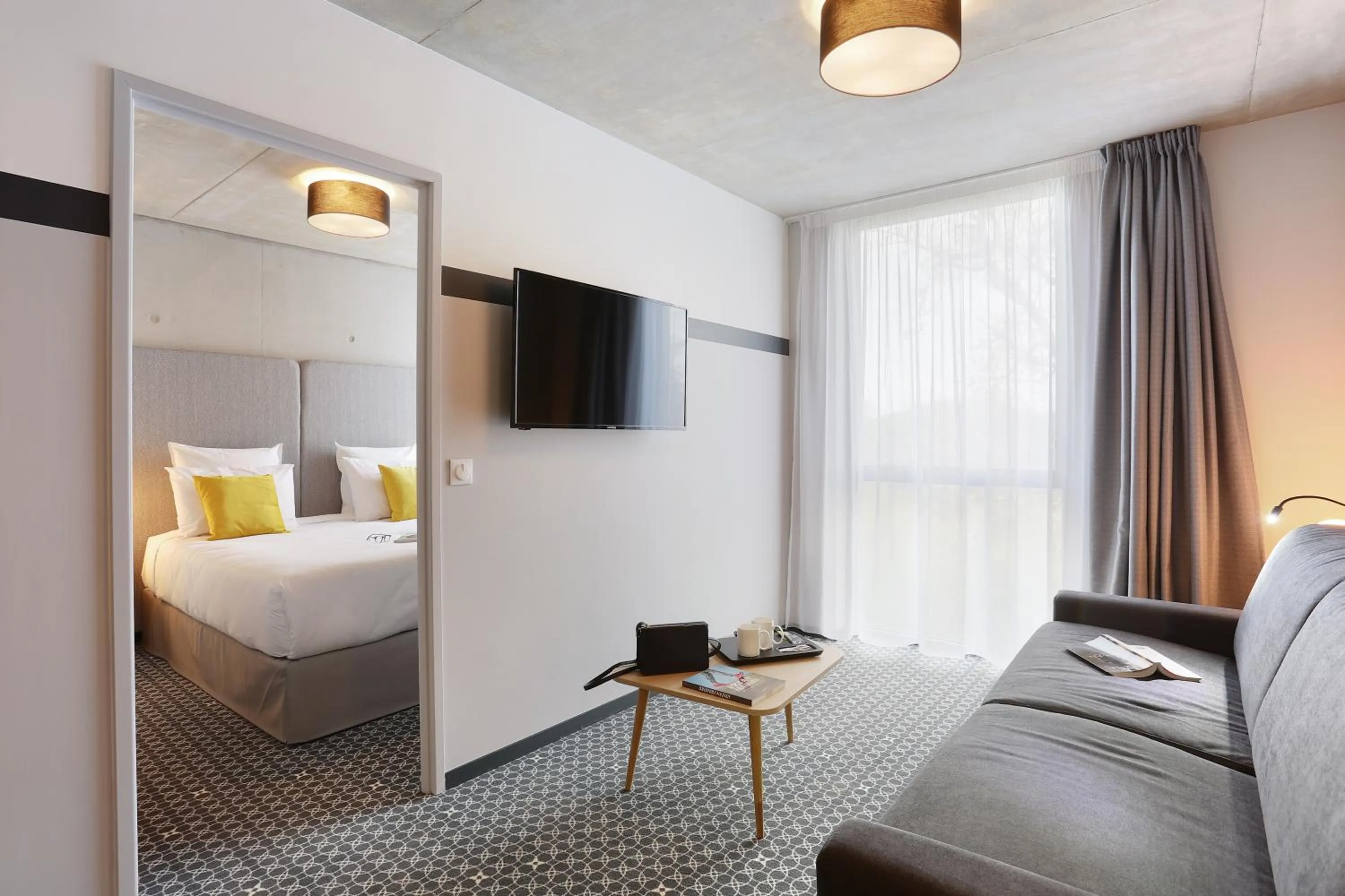 Communal lounge/ TV room, Bed in Appart Hotel Odalys City Toulouse Blagnac Aéroport