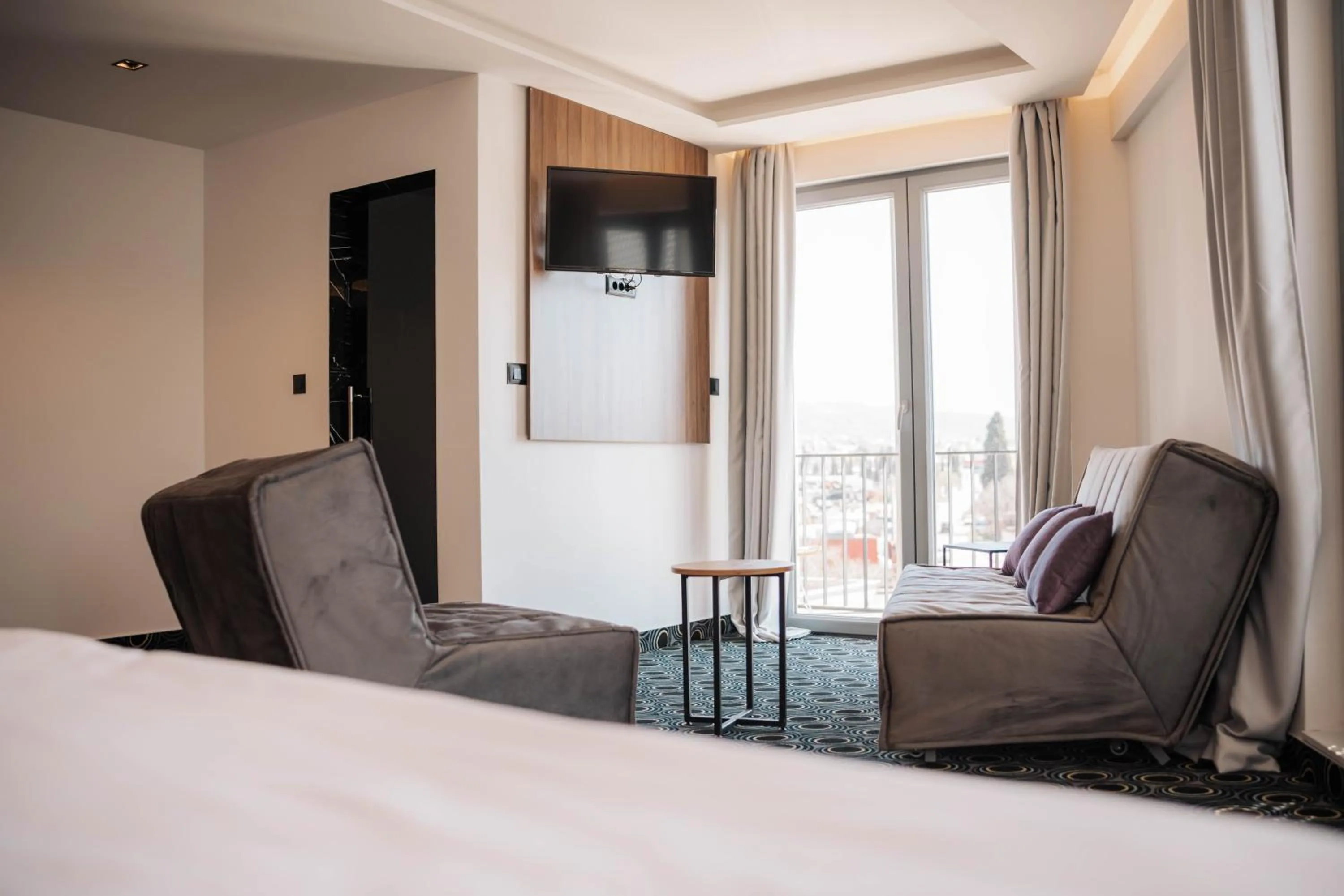 Seating area, Bed in Hotel Carpe Diem