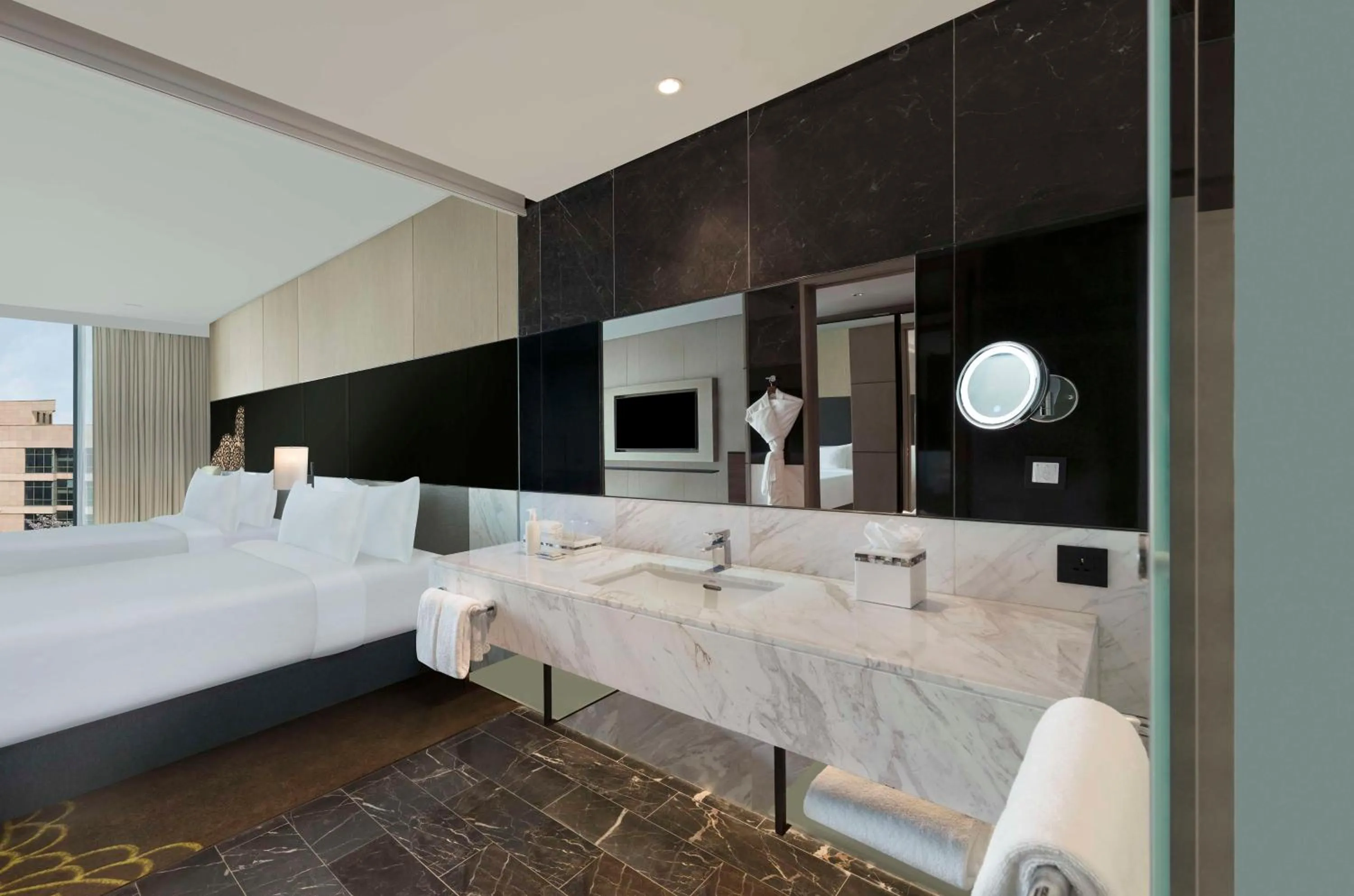 Bathroom, Bed in Hilton Bengaluru Embassy Manyata Business Park