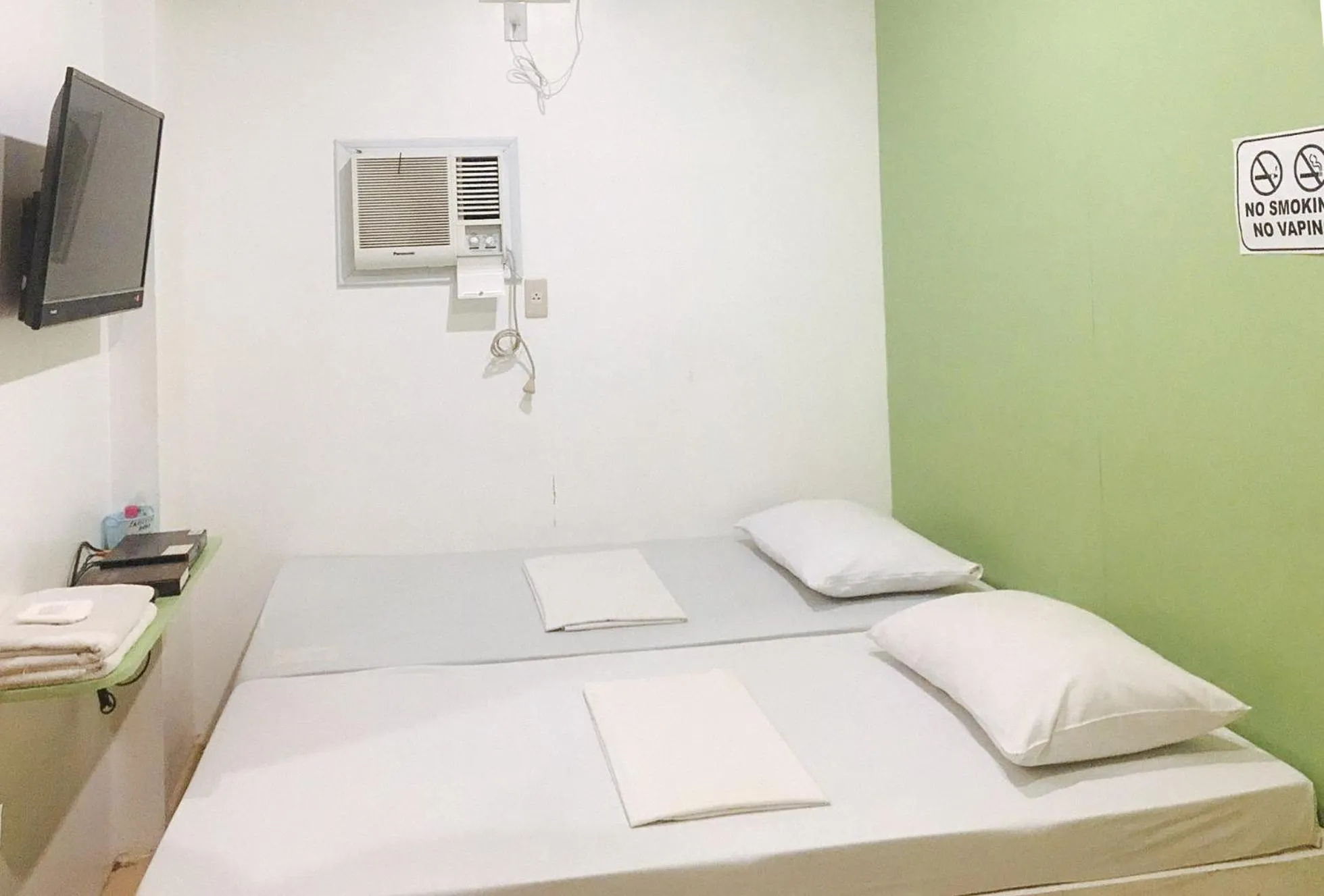 Bedroom, Bed in Mainstreet Pension House by RedDoorz