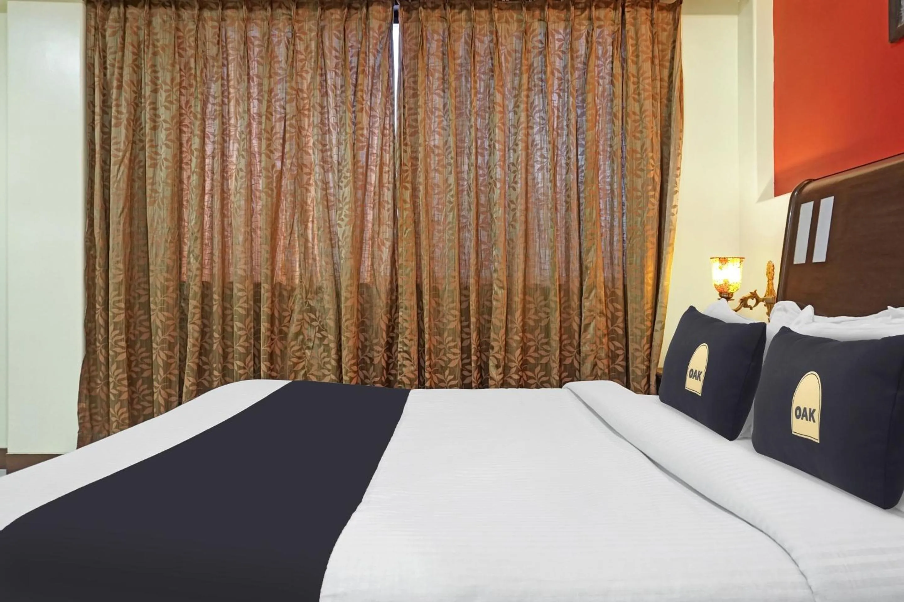 Deluxe Triple Room - single occupancy in Super Townhouse OAK Gharonda Residency Near Sant Tukaram Nagar Metro Station