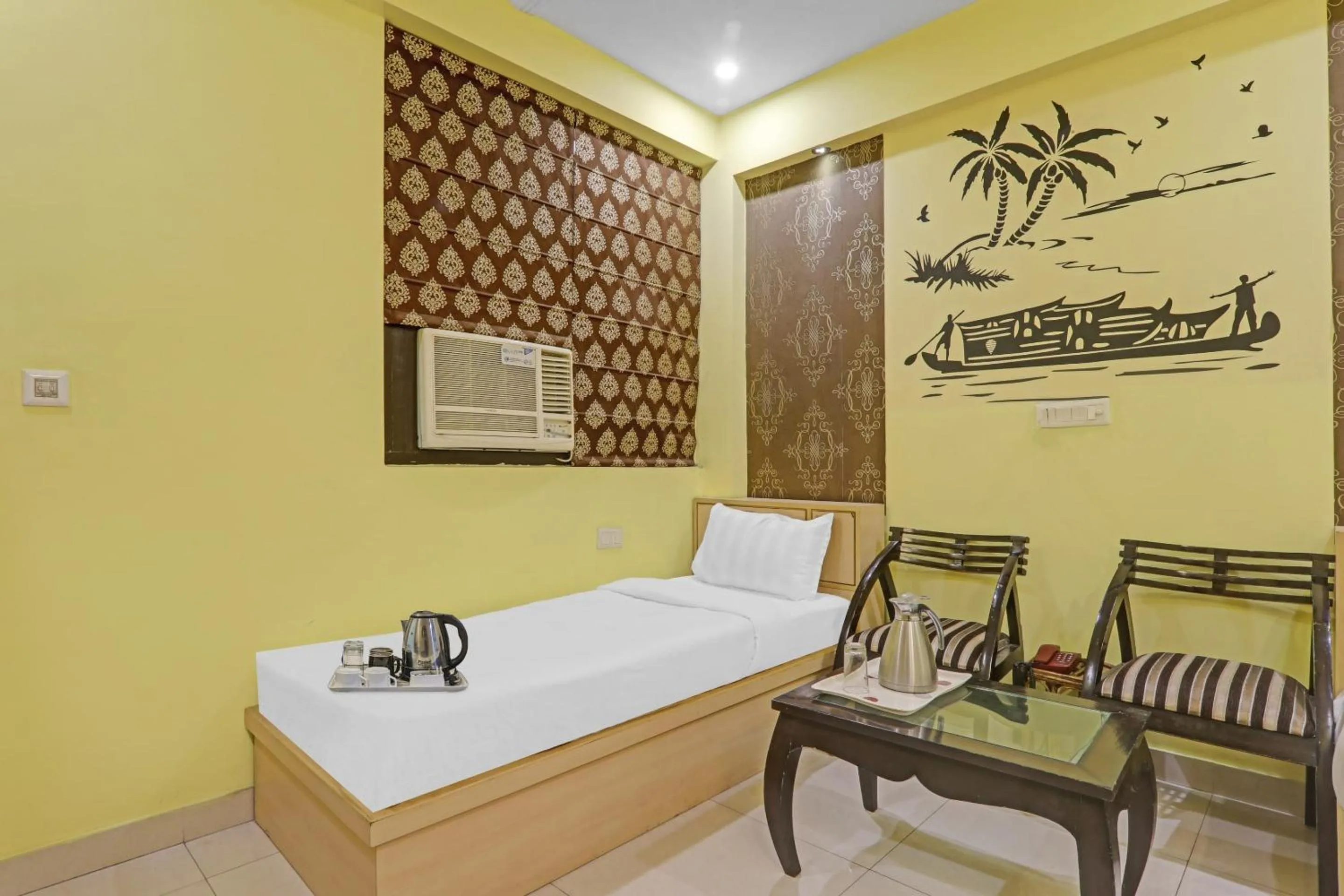 Bedroom, Bed in Capital O Townhouse Govinda Royal