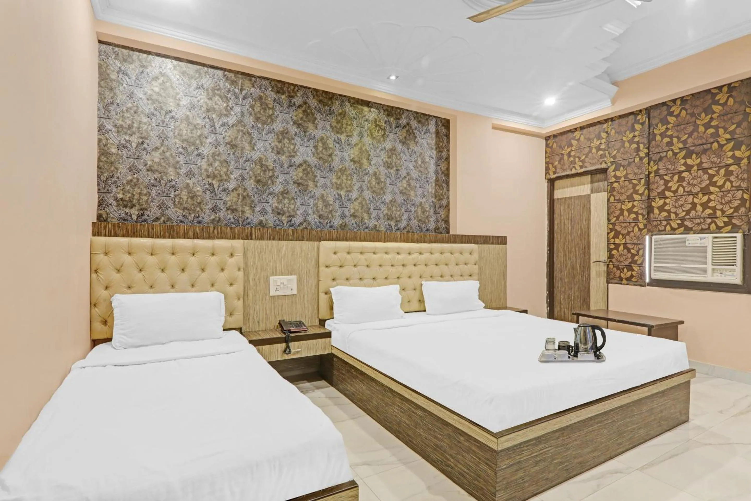 Bedroom, Bed in Capital O Townhouse Govinda Royal