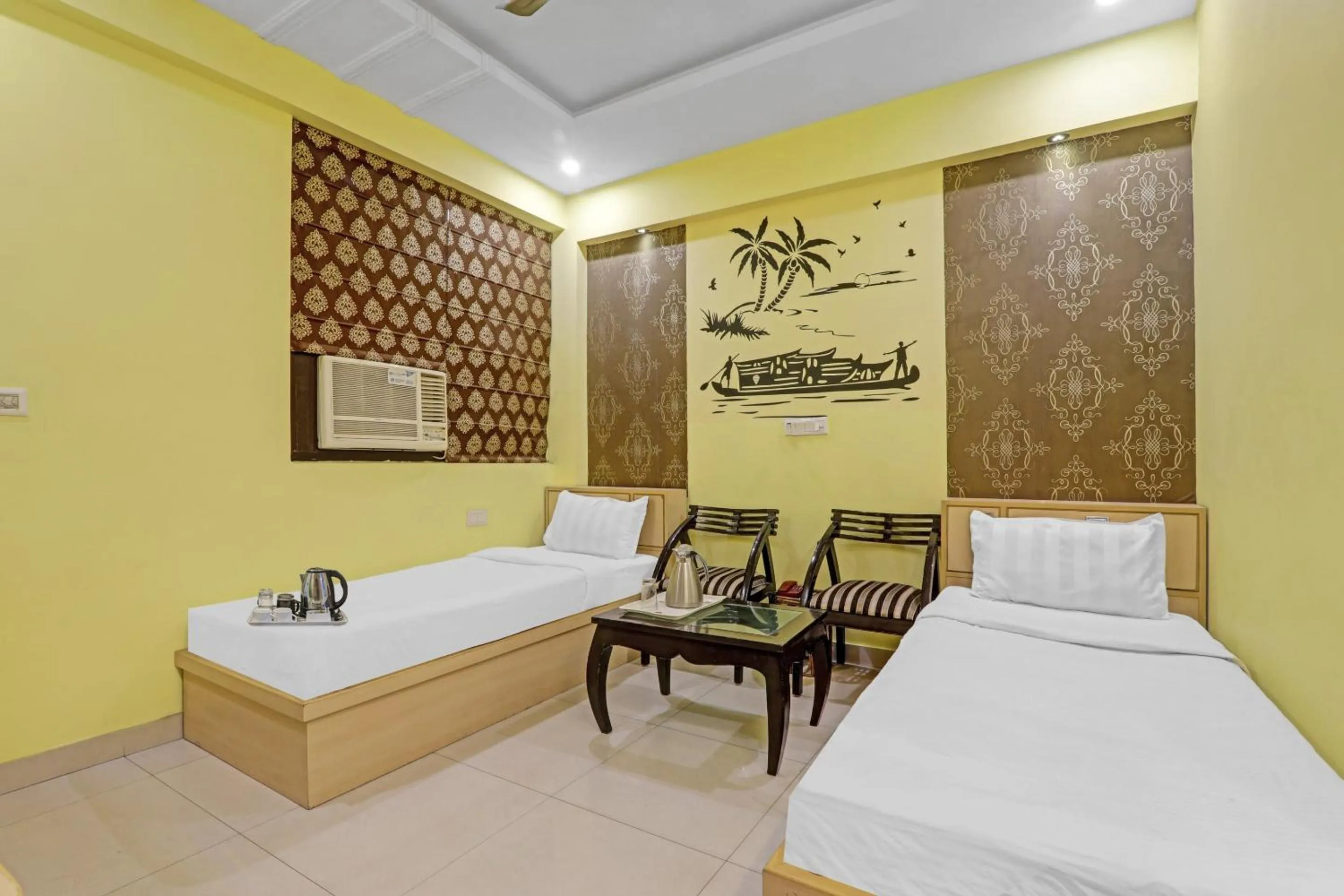 Bedroom, Bed in Capital O Townhouse Govinda Royal