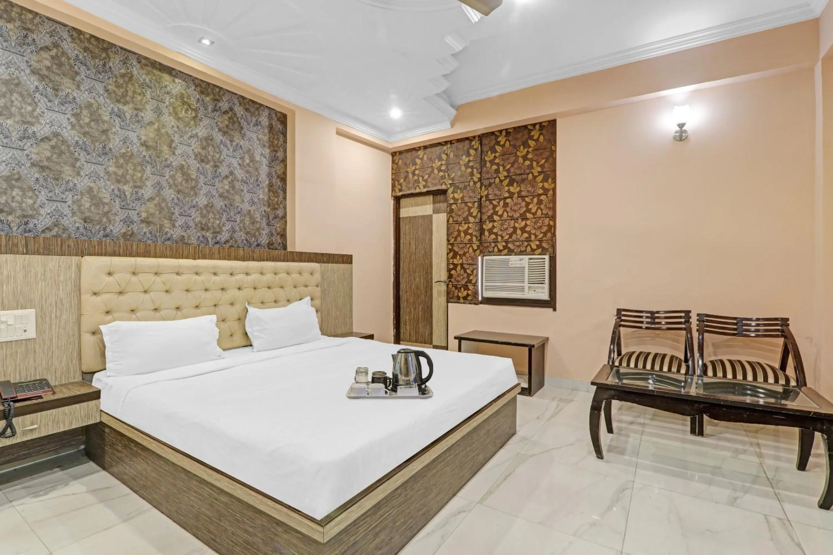 Bedroom, Bed in Capital O Townhouse Govinda Royal