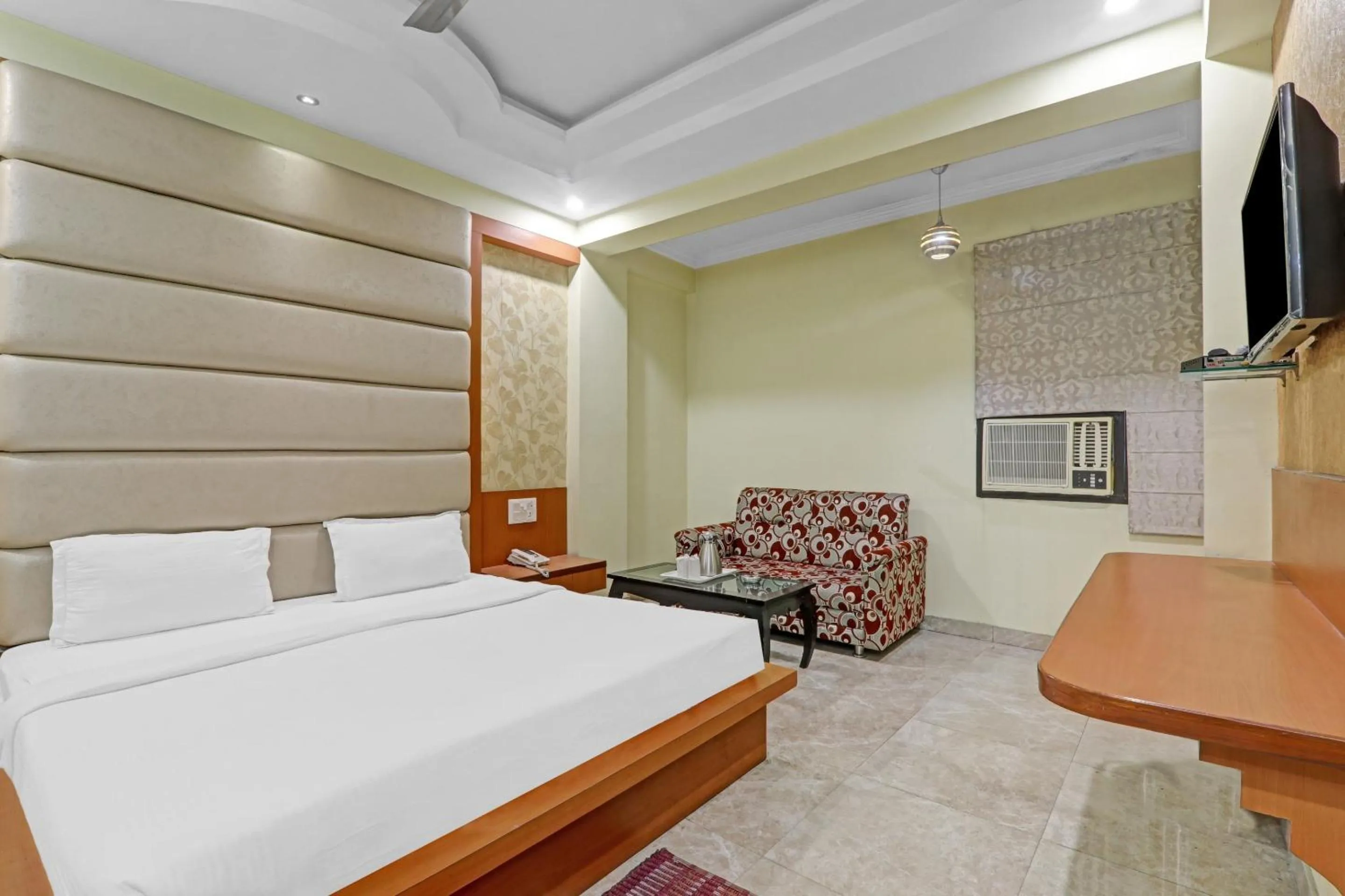 Bedroom, Bed in Capital O Townhouse Govinda Royal